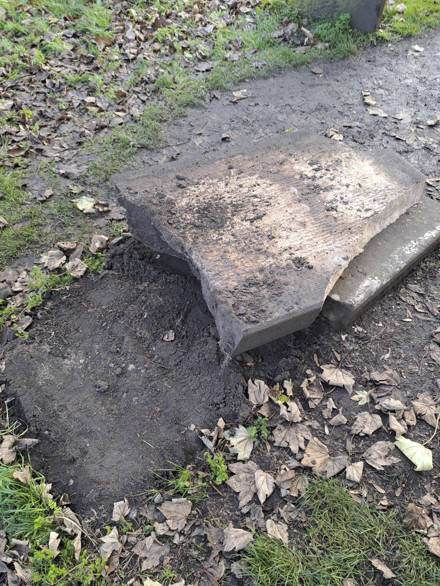 In this picture, provided by the West Mercia Police on Monday, Nov. 25, 2024, a smashed movie prop tombstone that was used for the "A Christmas Carol" movie is seen in Shrewsbury, England. (West Mercia Police via AP)