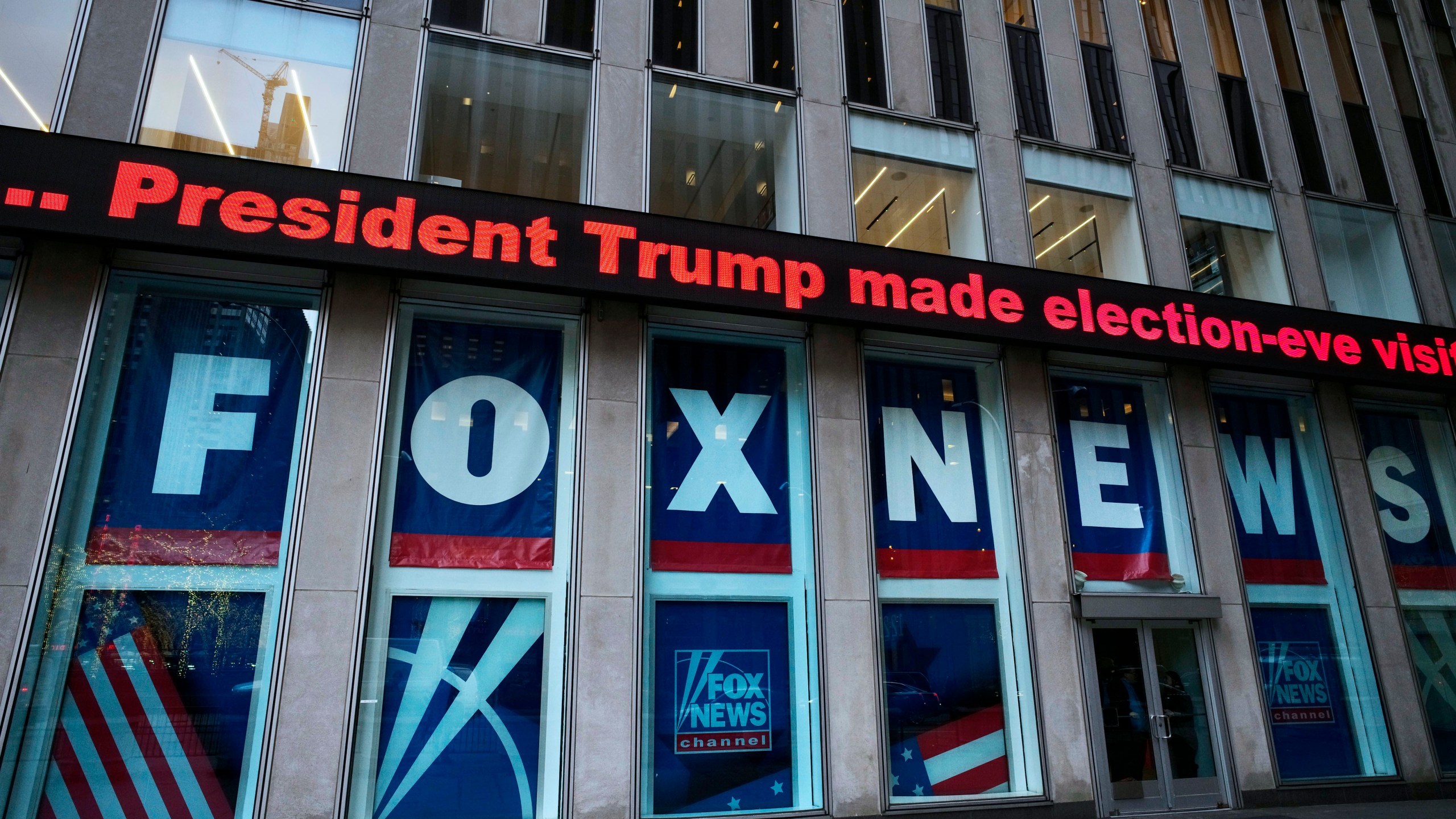 FILE - A headline about President Donald Trump is shown outside Fox News studios, Nov. 28, 2018, in New York. (AP Photo/Mark Lennihan, File)