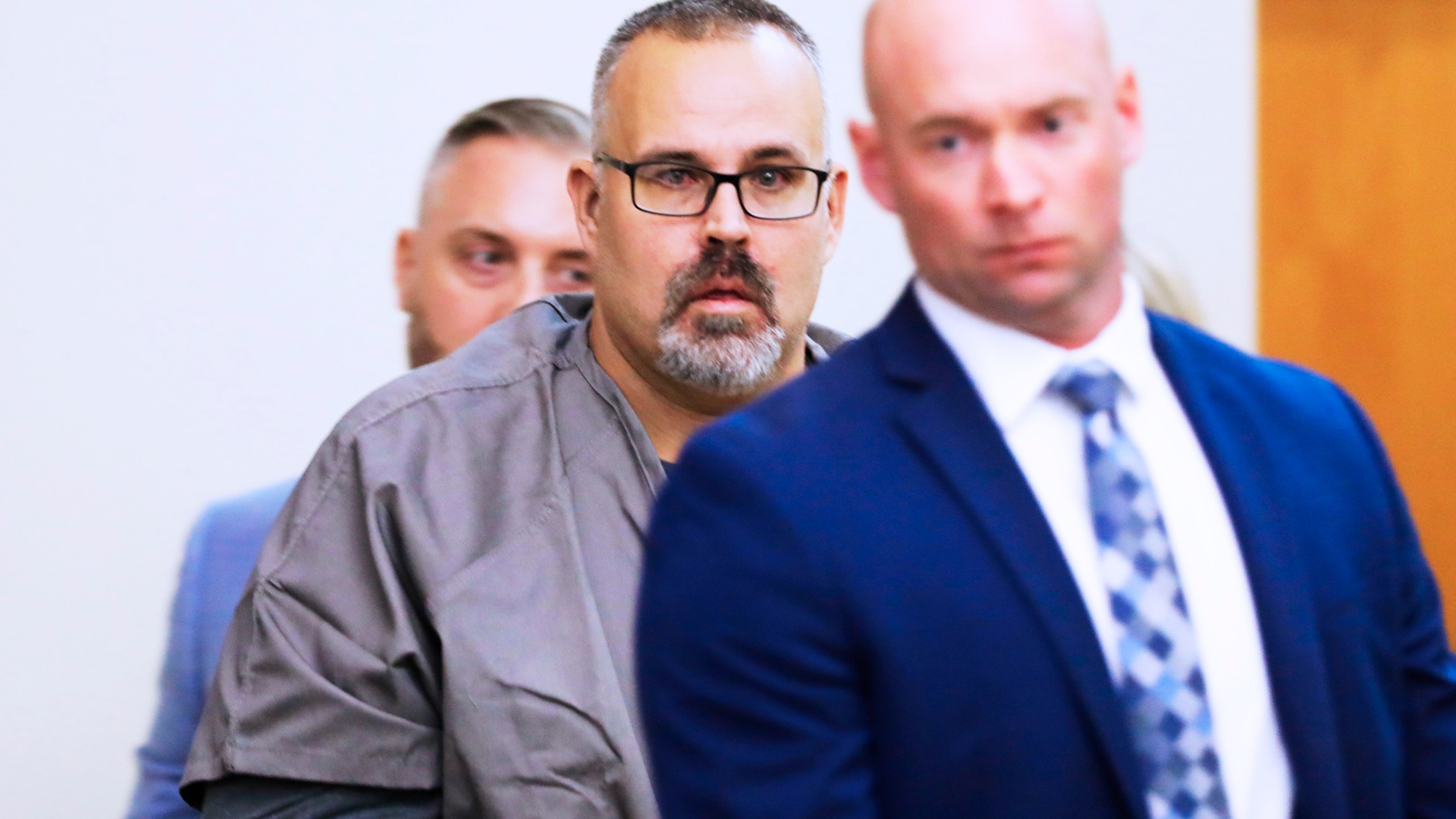 Ex-Letcher County Sheriff Shawn "Mickey" Stines in tears seeing his family as he enters a Letcher County Circuit Court courtroom on November 25, 2024, during his arraignment for the September fatal shooting of district judge Kevin Mullins in Whitesburg, Ky. (Tasha Poullard/Lexington Herald-Leader via AP)