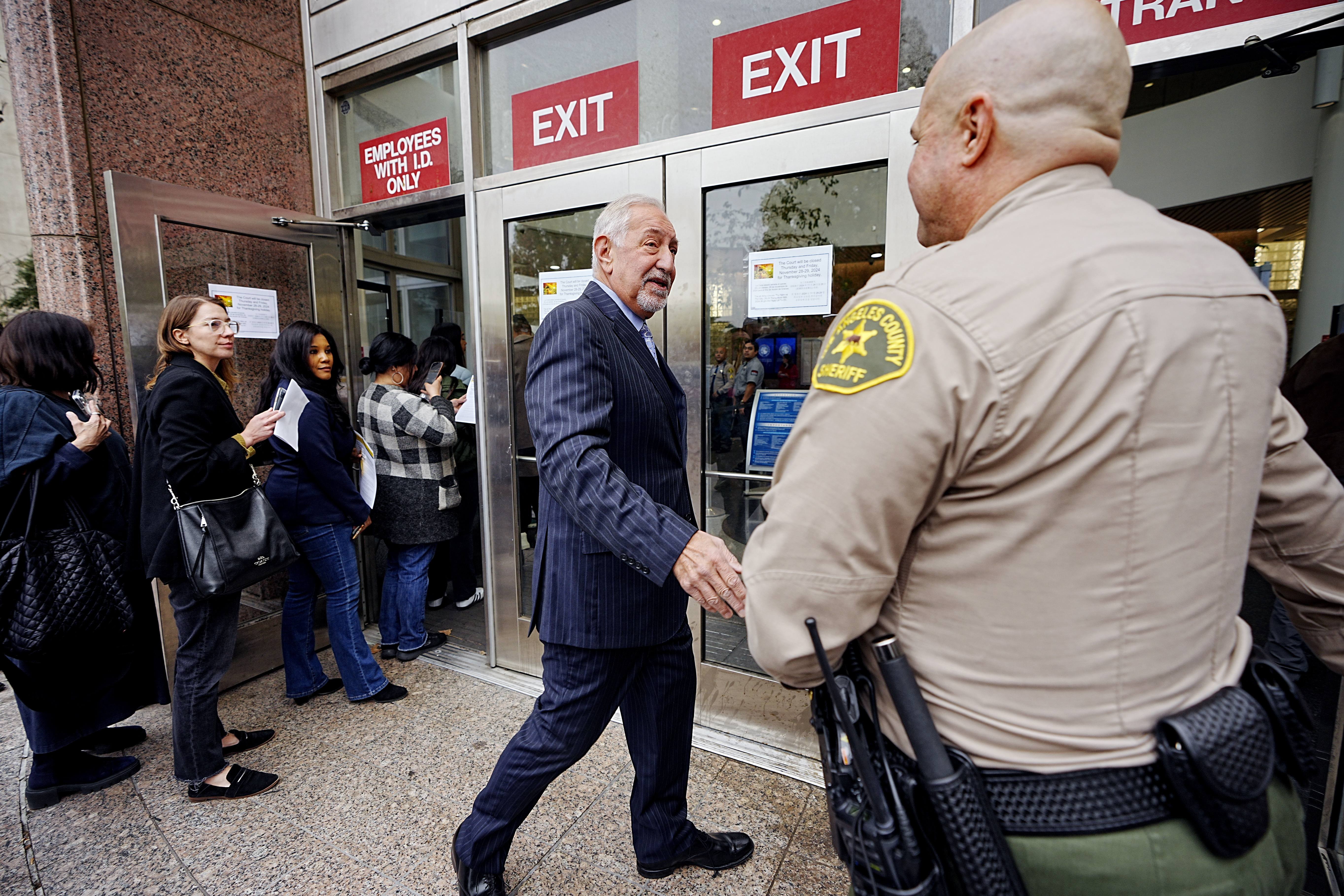 Defense Attorney Mark Geragos, arrives at the Van Nuys courthouse in Los Angeles, for a hearing for Erik and Lyle Menendez, on Monday, Nov. 25, 2024. (AP Photo/Damian Dovarganes)