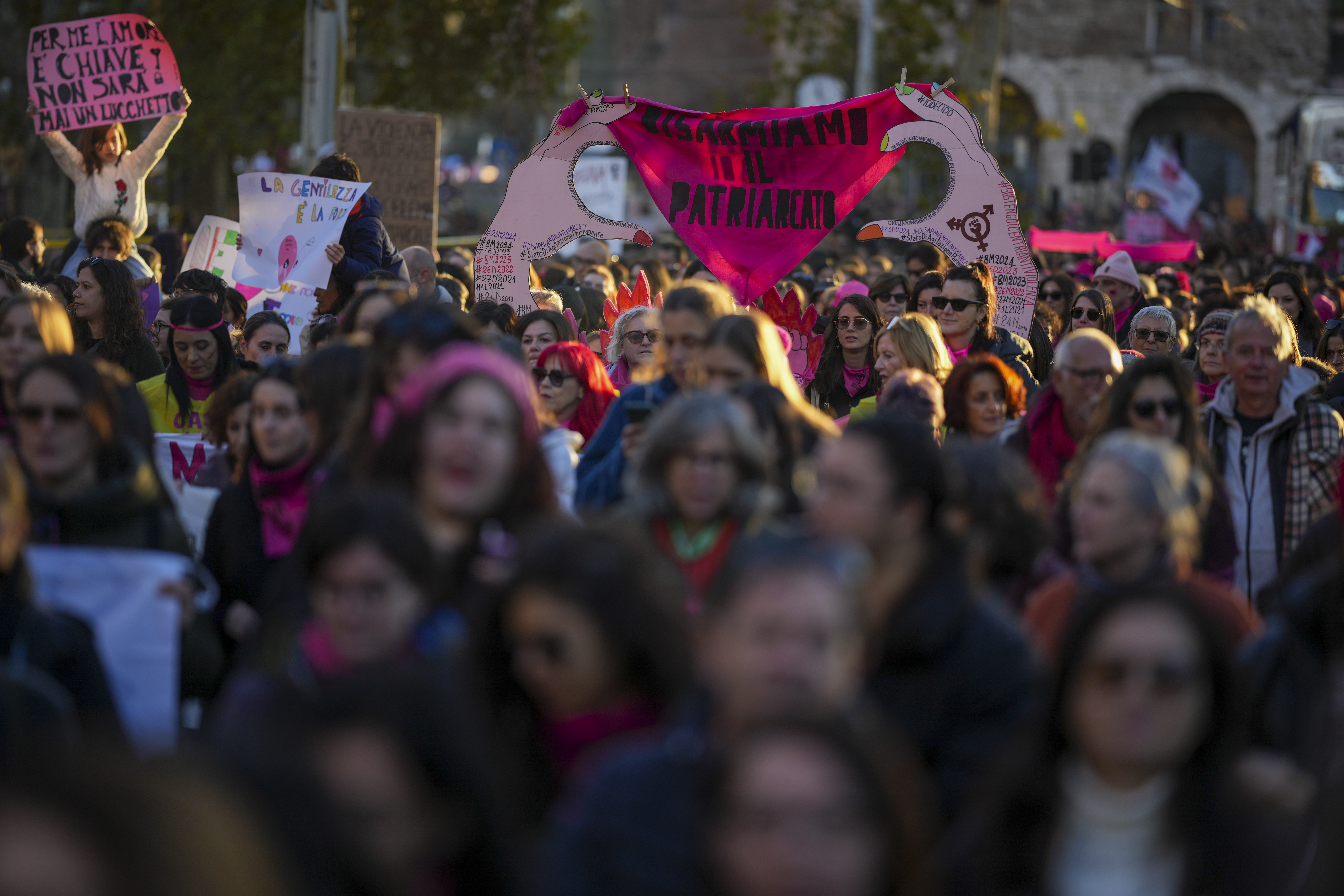 Demonstrators take part in a rally ahead of the International Day for the Elimination of Violence against Women which will be held on Nov. 25, in Rome, Saturday, Nov. 23, 2024. (AP Photo/Andrew Medichini)