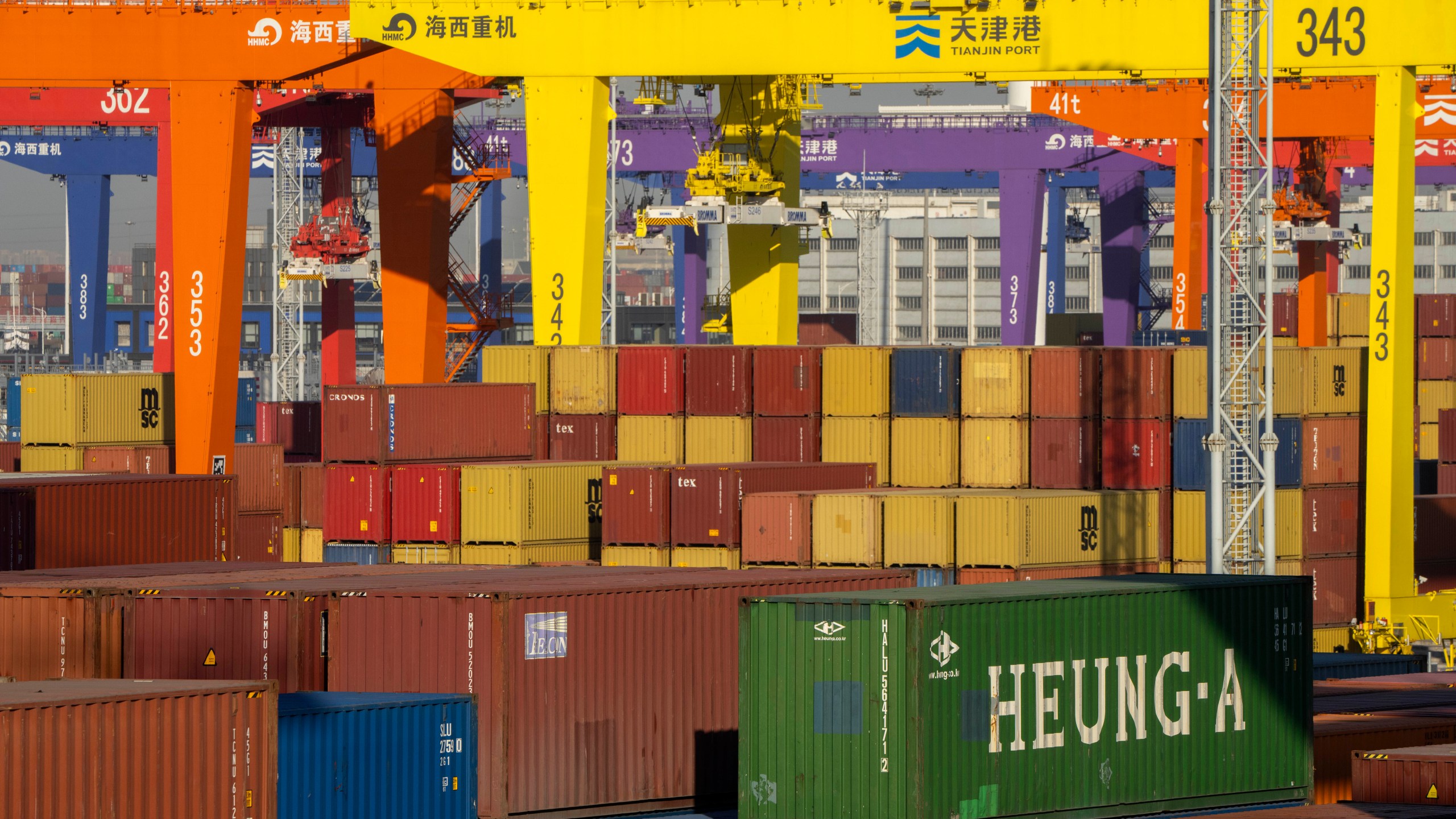 FILE - Shipping containers are stacked at a port in Tianjin, China, Jan. 16, 2023. (AP Photo/Mark Schiefelbein, File)