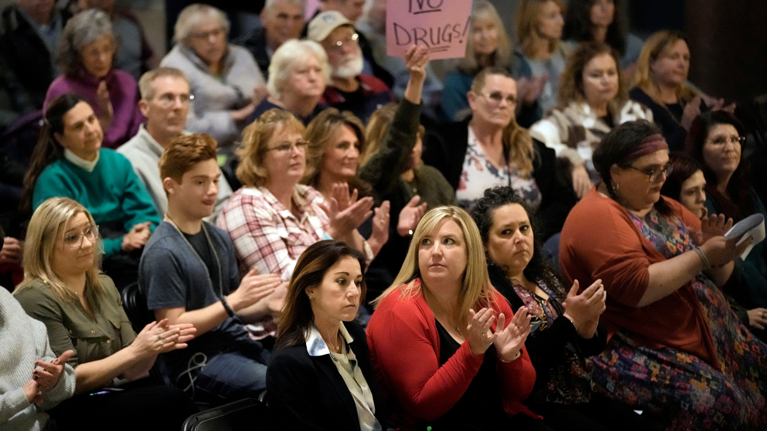 FILE - People applaud during a rally in favor of legislation banning gender-affirming healthcare for minors, Monday, March 20, 2023, at the Missouri Statehouse in Jefferson City, Mo. (AP Photo/Charlie Riedel, File)