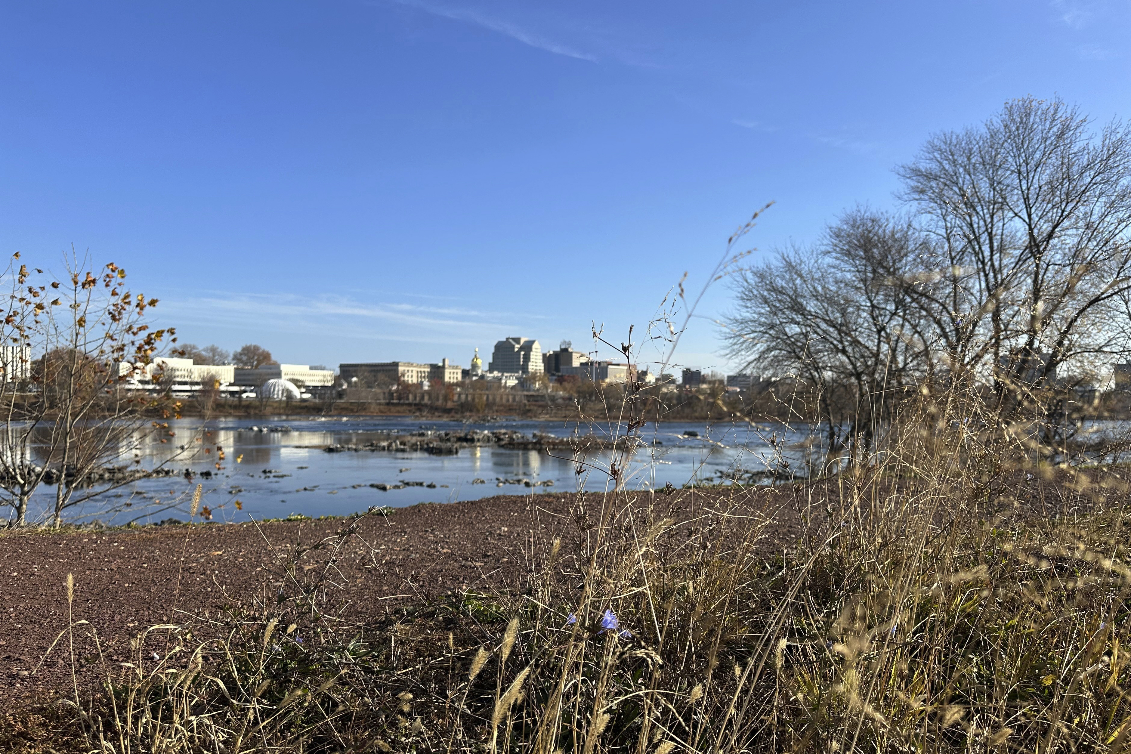 The Delaware River overlooking Trenton, N.J. flows downstream as seen from from Morrisville, Pa., on Monday, Nov. 25, 2024. (AP Photo/Mike Catalini)