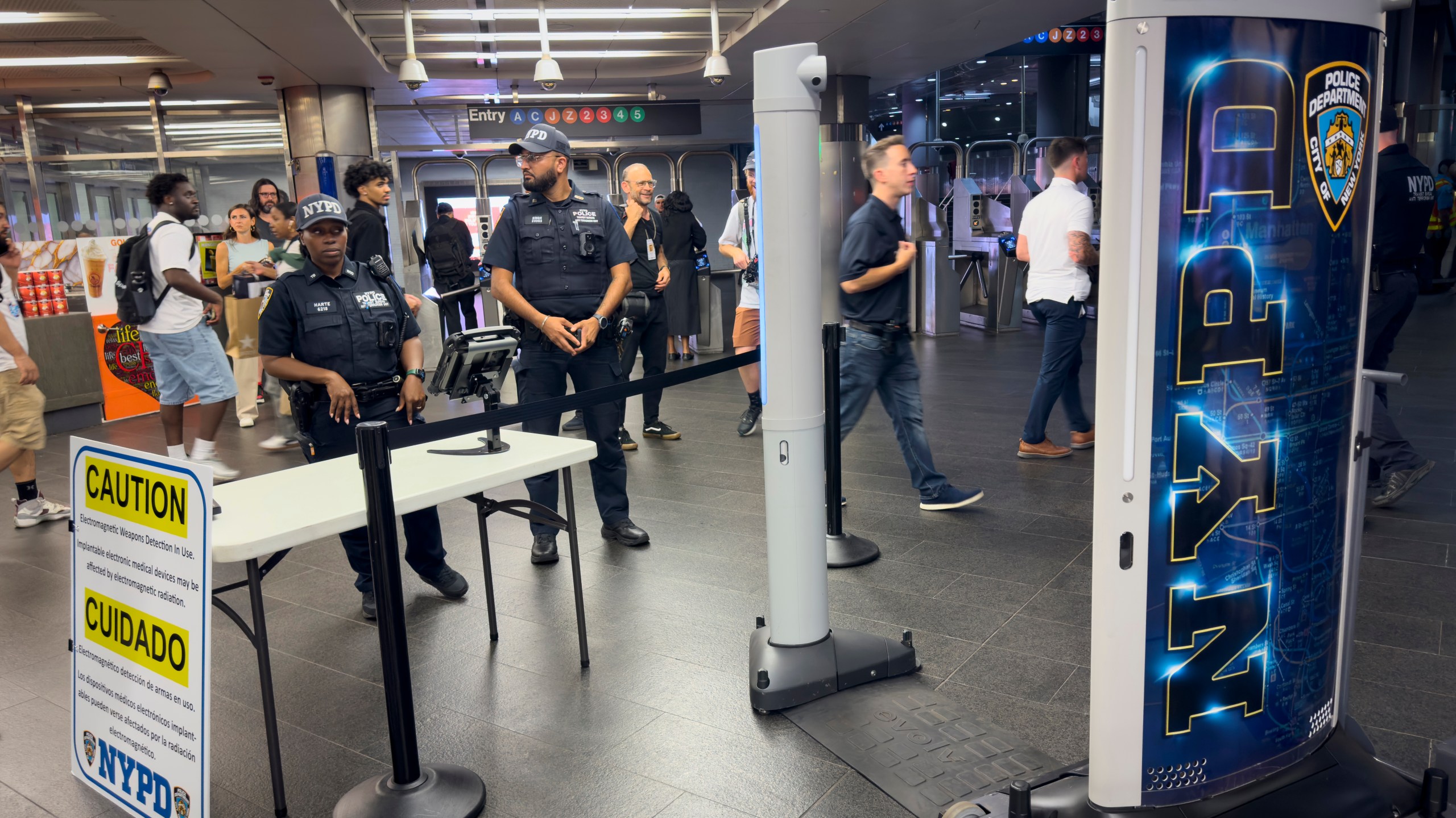 FILE - Gun detection machines are tested at the Fulton Street transit station, July 26, 2024, in New York. (AP Photo/John Minchillo, File)