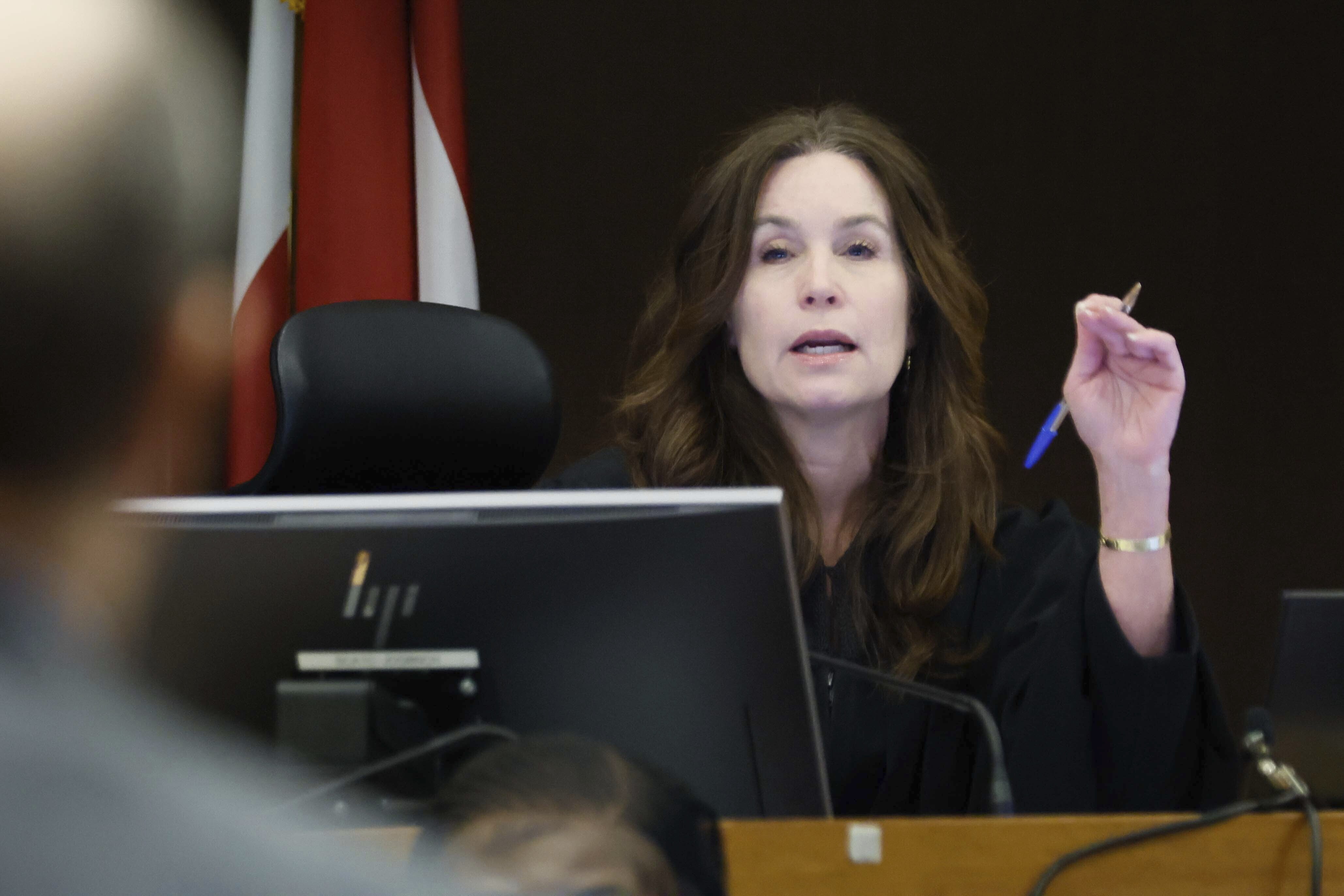 Fulton County Superior Court Judge Paige Reese Whitaker speaks with a prosecutor during the Young Thug trial at Fulton County Courthouse in Atlanta on Tuesday, Nov. 26, 2024. (Miguel Martinez/Atlanta Journal-Constitution via AP)