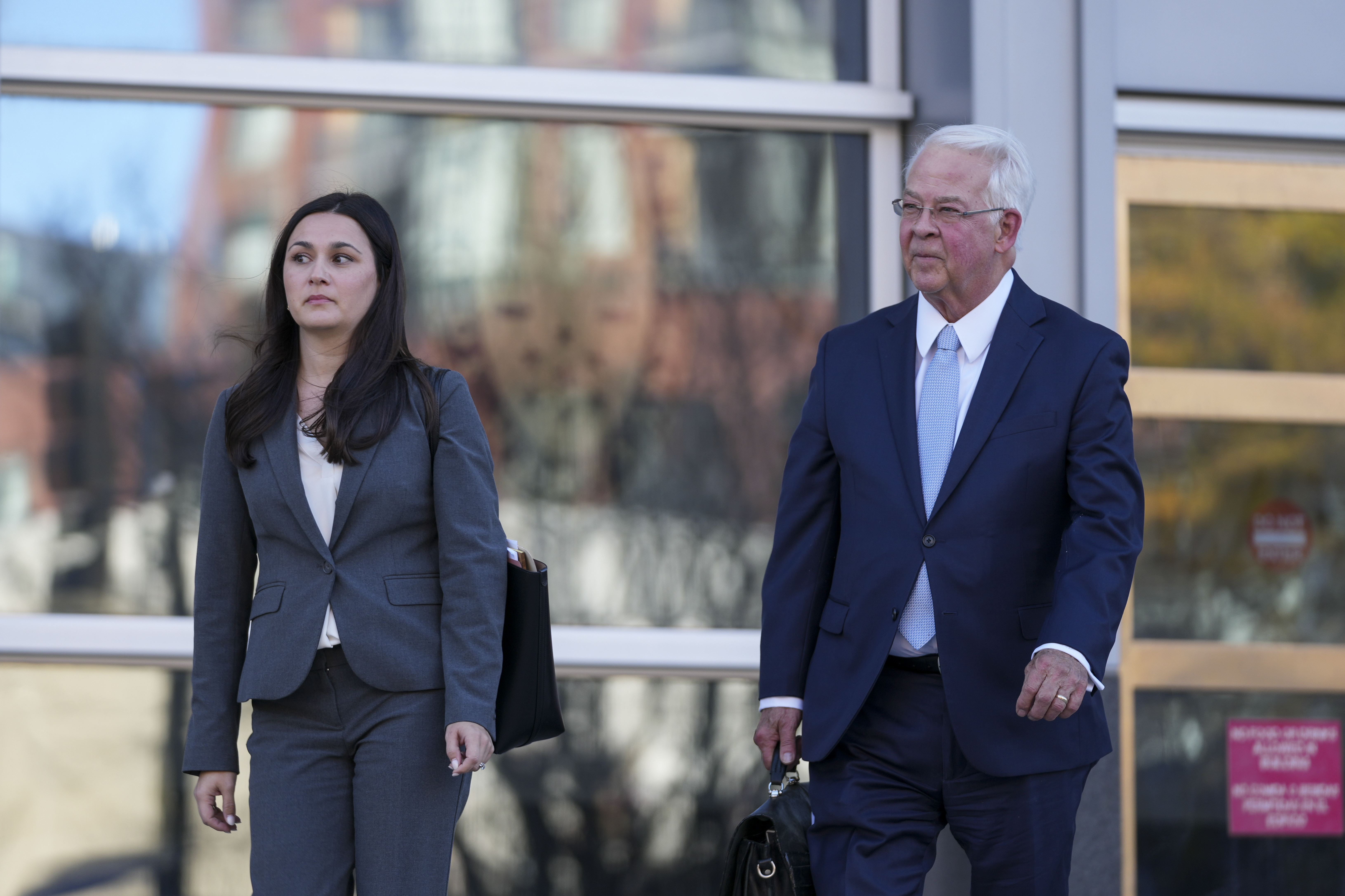 Megan Coleman and Robert Bonsib, attorneys representing Eduardo Valdivia, an FBI agent accused of sexually assaulting two women, leave the Montgomery County District Court in Rockville, Md., following a bond hearing for Valdivia, Tuesday, Nov. 26, 2024. (AP Photo/Stephanie Scarbrough)