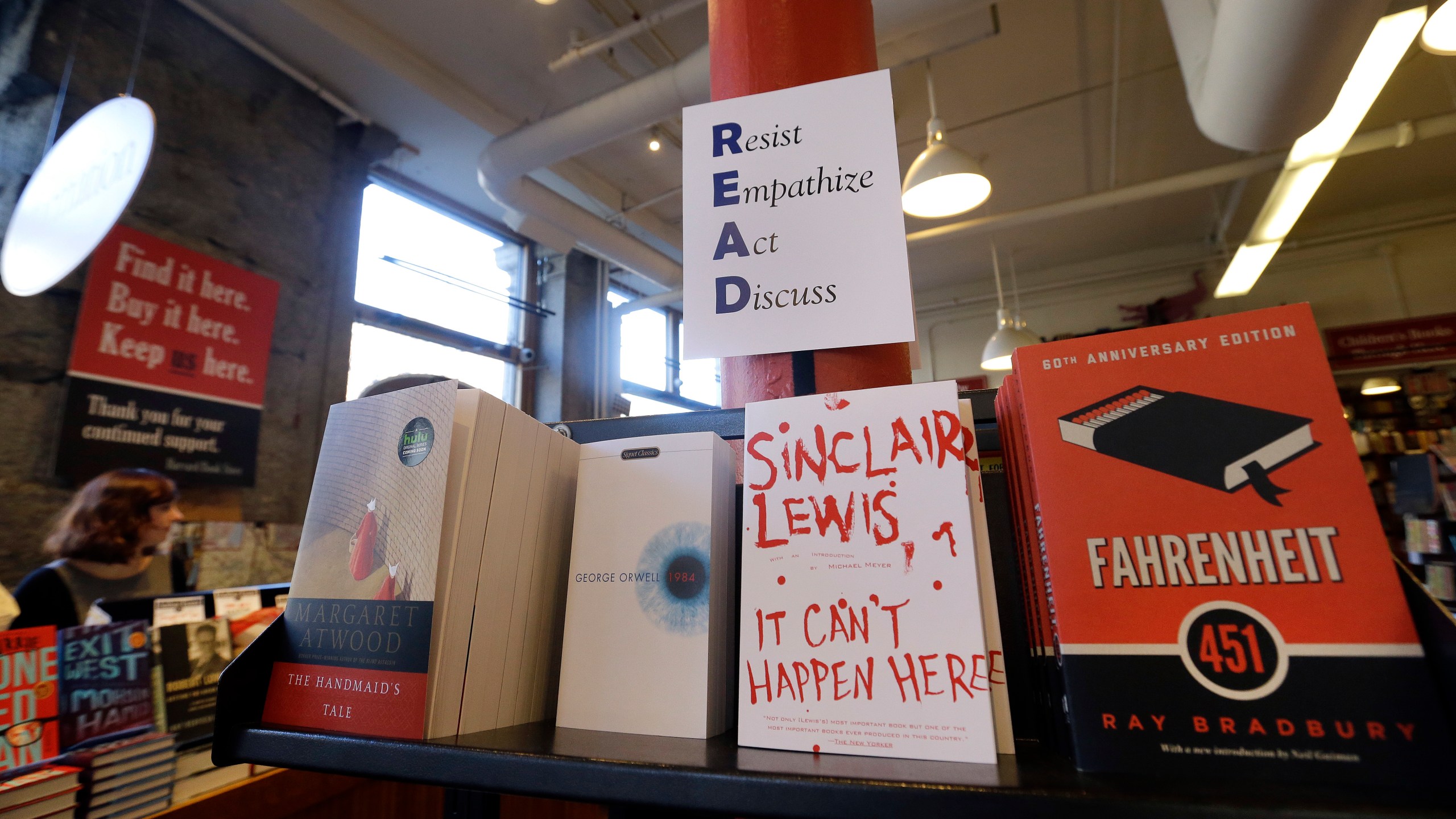 FILE - Books are displayed under a sign at the Harvard Book Store, Thursday, March 9, 2017, in Cambridge, Mass. (AP Photo/Elise Amendola, File)