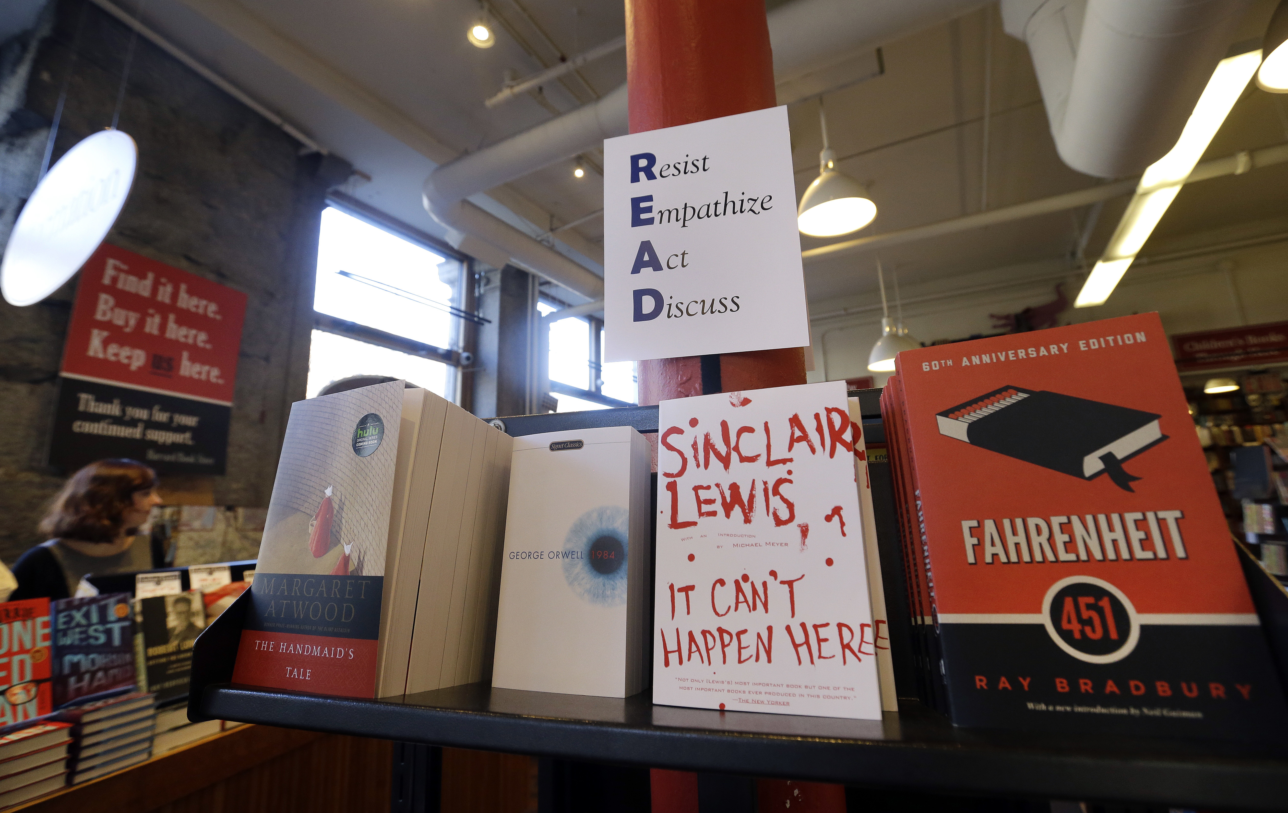 FILE - Books are displayed under a sign at the Harvard Book Store, Thursday, March 9, 2017, in Cambridge, Mass. (AP Photo/Elise Amendola, File)