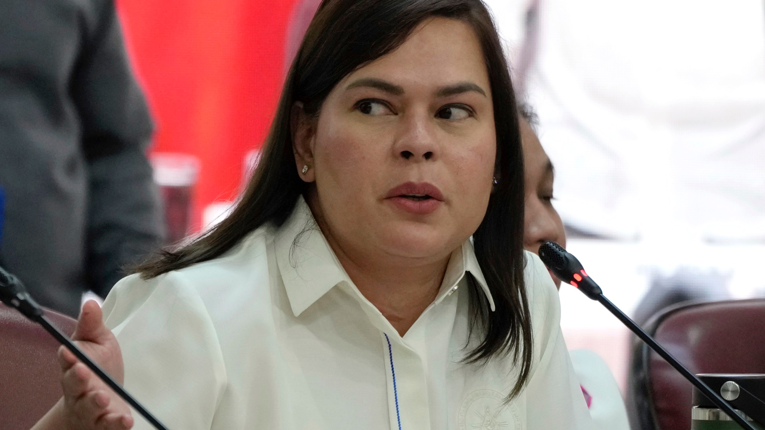 Philippine Vice President Sara Duterte gestures as she attends a hearing at the House of Representative in Quezon City, Philippines on Monday Nov. 25, 2024. (AP Photo/Aaron Favila)