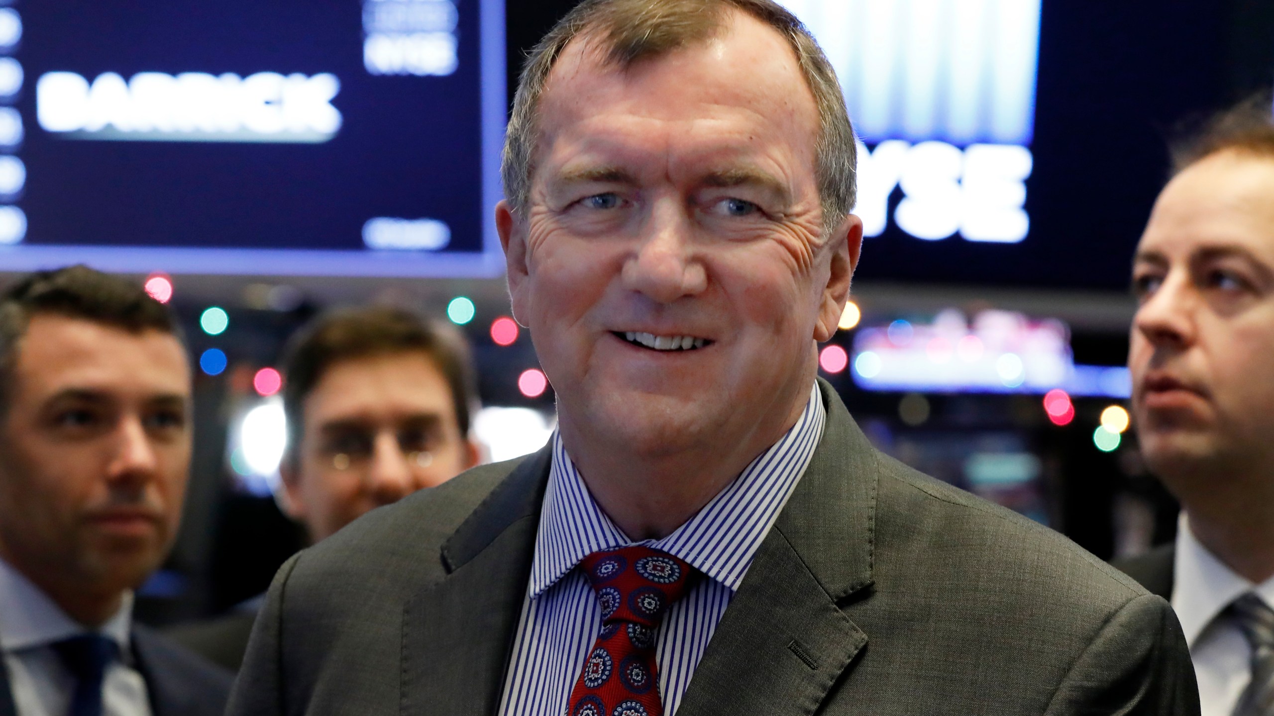 FILE - Barrick Gold Corporation President and CEO Mark Bristow visits the trading floor of the New York Stock Exchange after ringing the opening bell, Wednesday, Jan. 2, 2019. (AP Photo/Richard Drew, File)