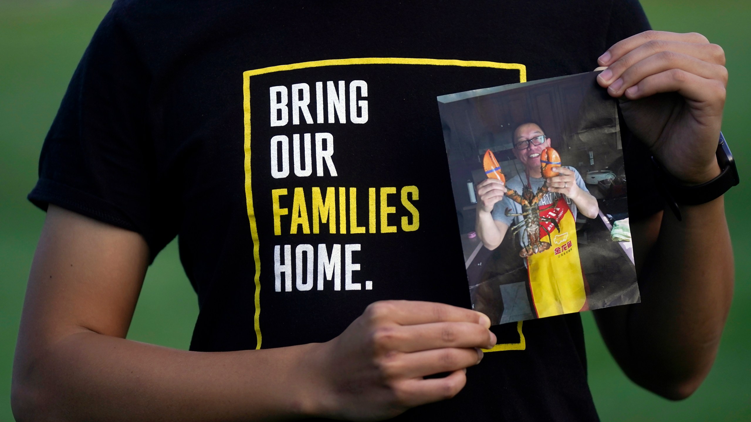 FILE - Harrison Li holds a photo of his father, Kai Li, as he poses for a photo, Tuesday, Jan. 23, 2024, in Palo Alto, Calif. (AP Photo/Jeff Chiu)