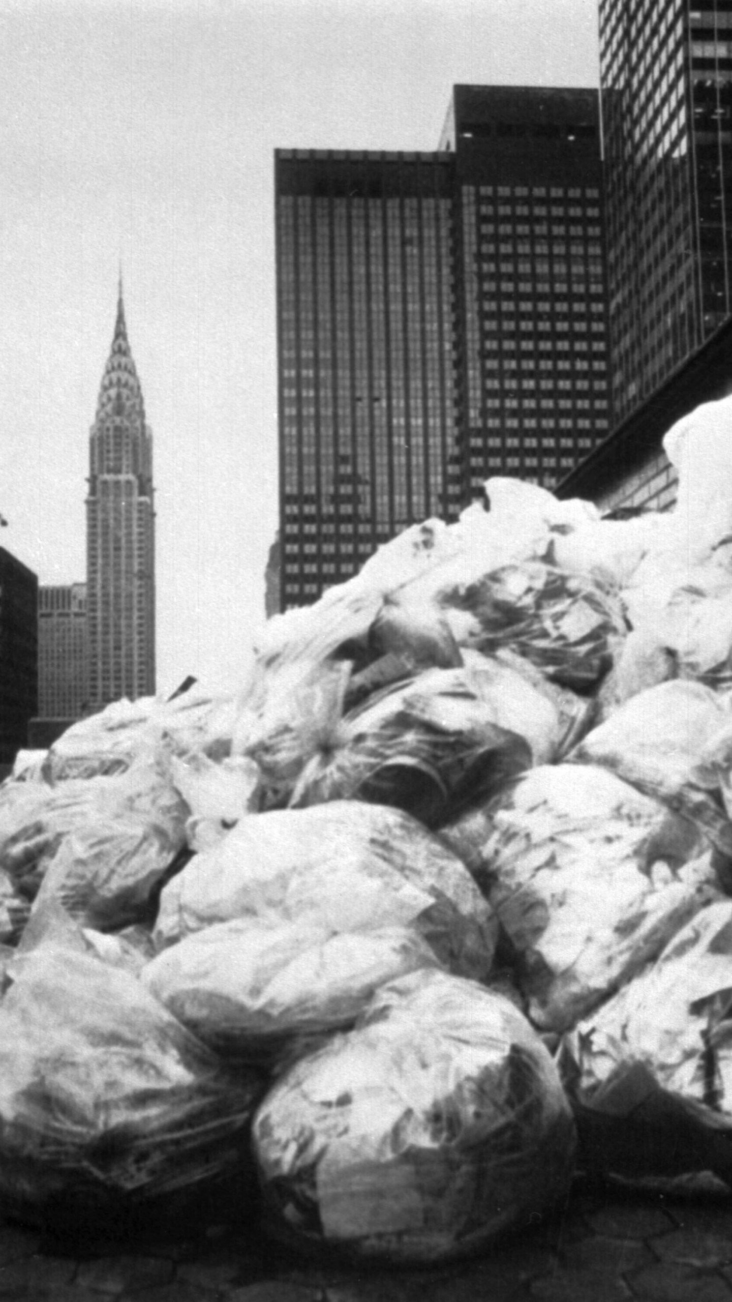 FILE - Garbage piles up on the roof of New York's Waldorf Astoria hotel during a strike by private garbage collectors, Dec. 4, 1981. (AP Photo/David Bookstaver, File)