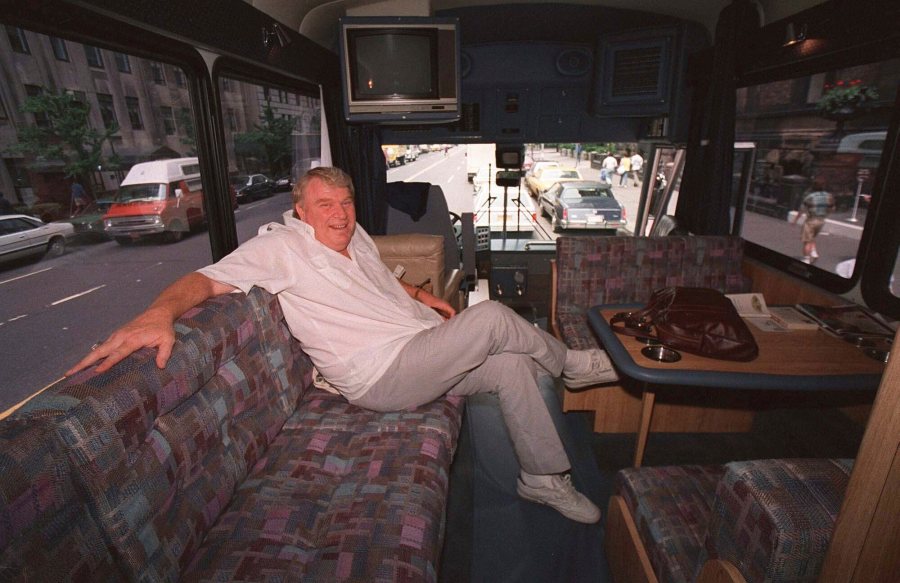 FILE - TV sports personality and former Oakland Raiders head coach John Madden enjoys the comforts of his custom-made bus while in New York June 10, 1987. (AP Photo/G. Paul Burnette, File)