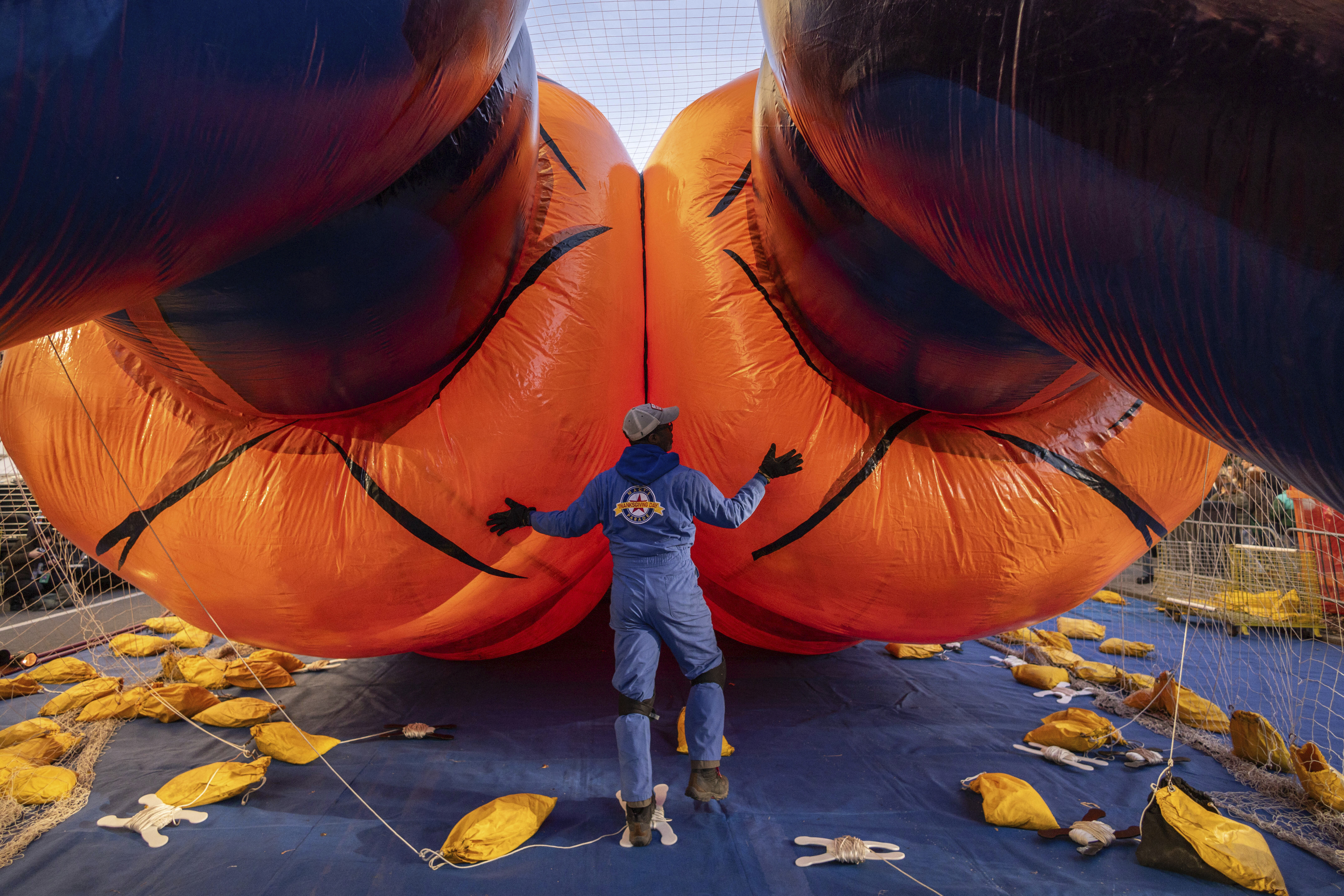 A person inflates a float of Goku in preparation for the Macy's Thanksgiving Day Parade, Wednesday, Nov. 27, 2024, in New York. (AP Photo/Yuki Iwamura)