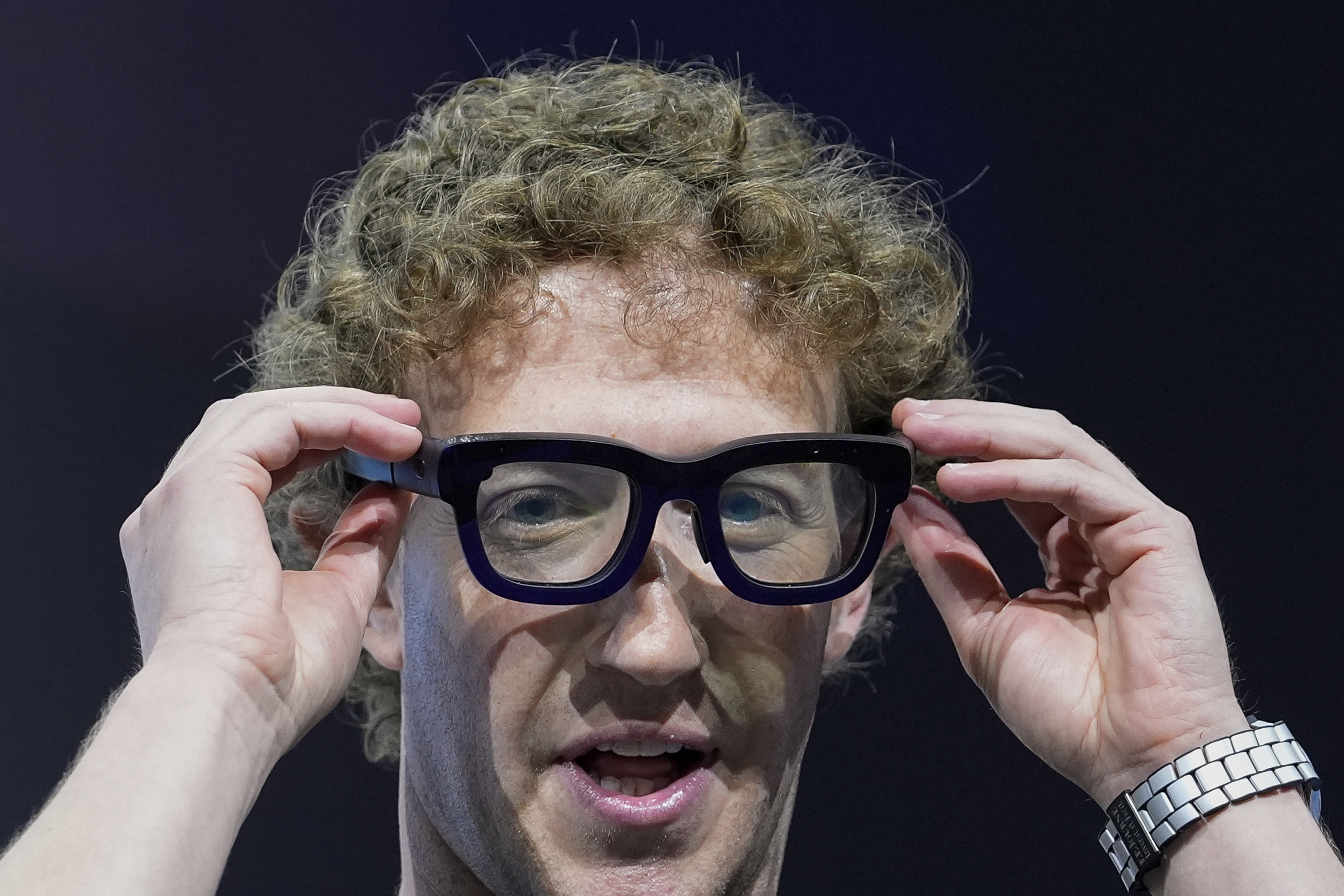 FILE - Mark Zuckerberg wears a pair of Orion AR glasses during the Meta Connect conference on Sept. 25, 2024, in Menlo Park, Calif. (AP Photo/Godofredo A. Vásquez, File)