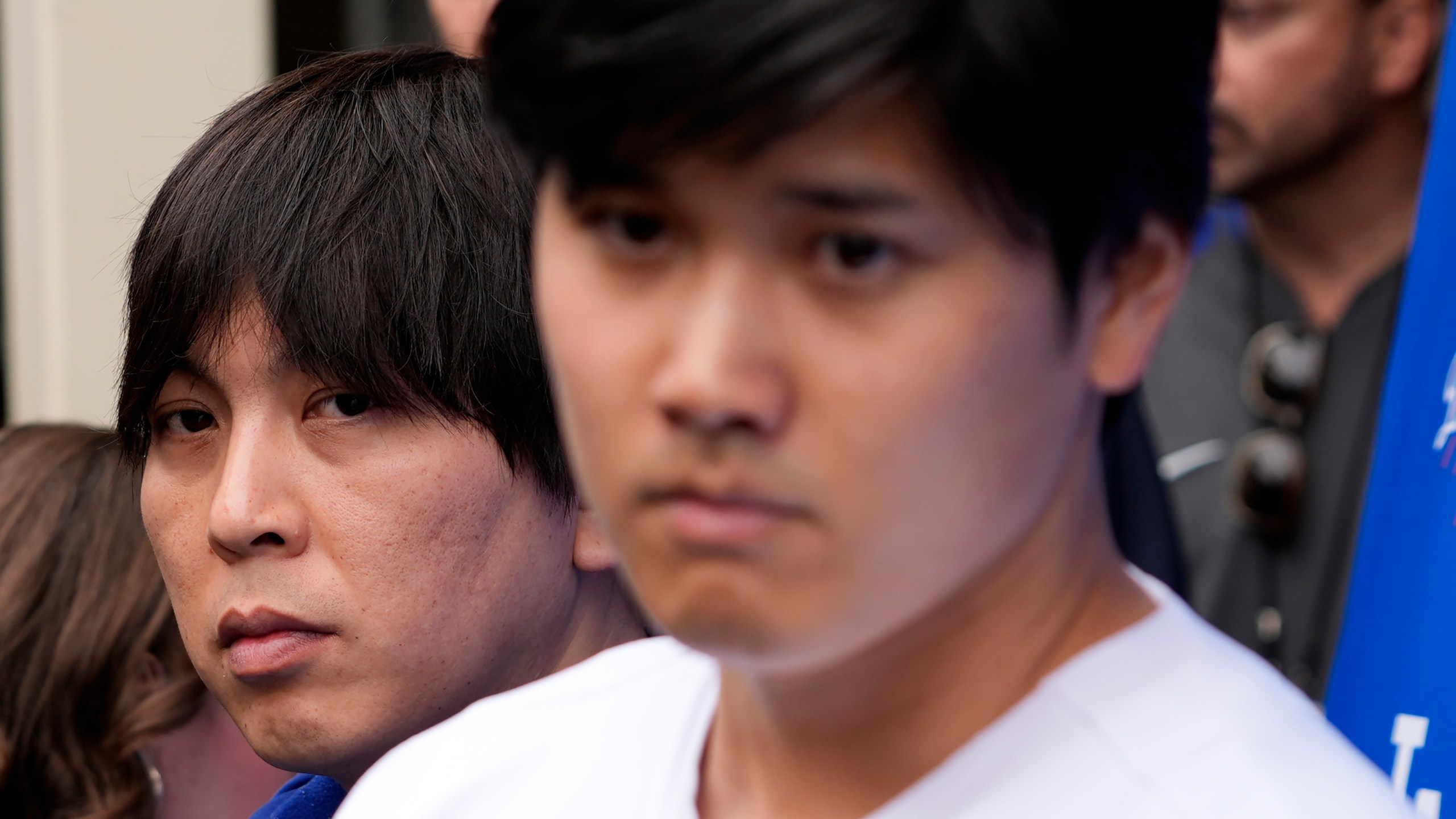 FILE - Ippei Mizuhara, left, stands next to Los Angeles Dodgers baseball player Shohei Ohtani, right, during an interview at Dodger Stadium, Feb. 3, 2024. (AP Photo/Richard Vogel, File)