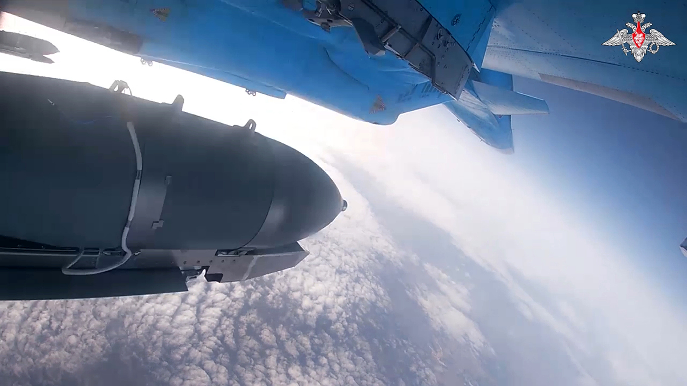 In this photo taken from video released by the Russian Defense Ministry on Thursday, Nov. 28, 2024, an Su-34 bomber of the Russian air force drops bombs on Ukrainian positions at an undisclosed location. (Russian Defense Ministry Press Service photo via AP)