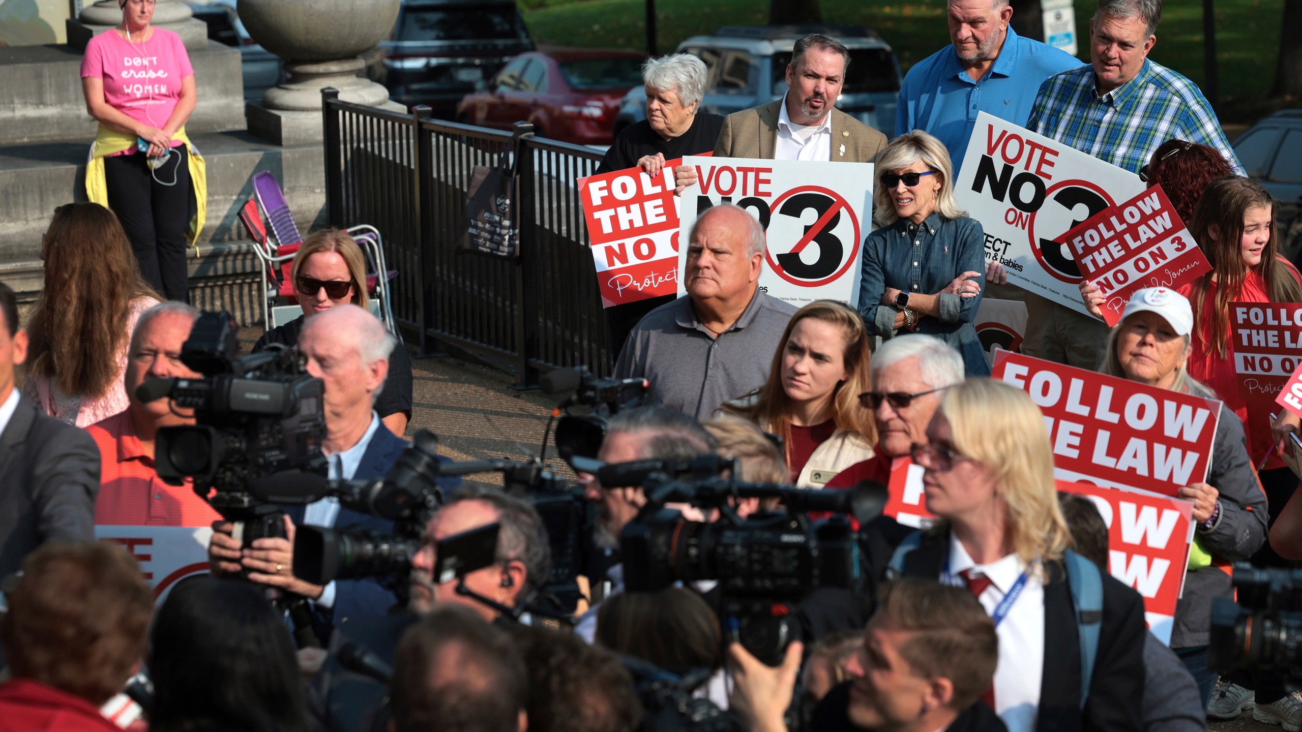 FILE - Abortion opponents watch and pray as members of the media interview attorney Mary Catherine Martin of the conservative Thomas More Society, after Missouri's Supreme Court heard arguments over whether an abortion-rights amendment should go before voters this year on Sept. 10, 2024 in Jefferson City, Mo. (Robert Cohen/St. Louis Post-Dispatch via AP, File)/St. Louis Post-Dispatch via AP)