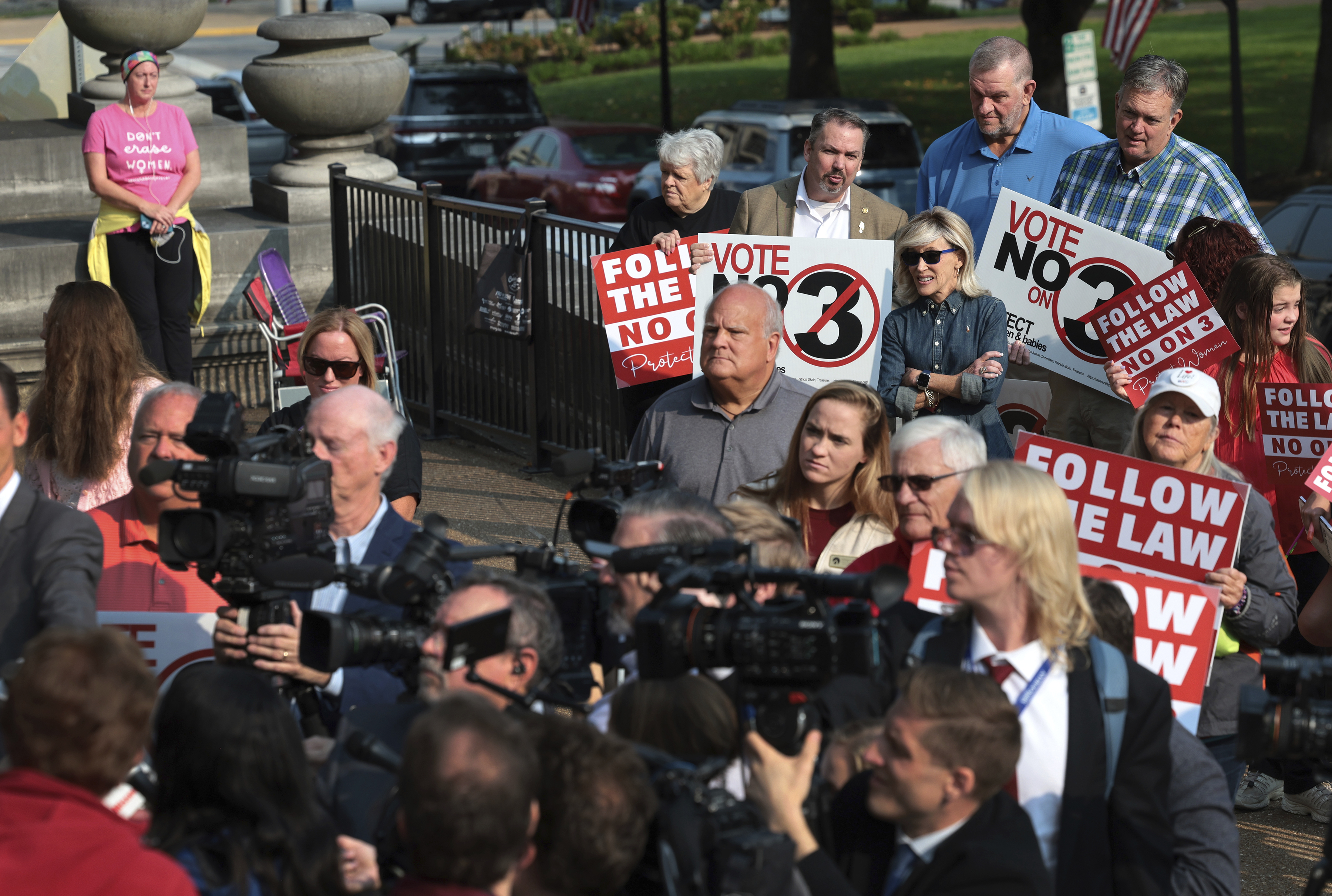 FILE - Abortion opponents watch and pray as members of the media interview attorney Mary Catherine Martin of the conservative Thomas More Society, after Missouri's Supreme Court heard arguments over whether an abortion-rights amendment should go before voters this year on Sept. 10, 2024 in Jefferson City, Mo. (Robert Cohen/St. Louis Post-Dispatch via AP, File)/St. Louis Post-Dispatch via AP)