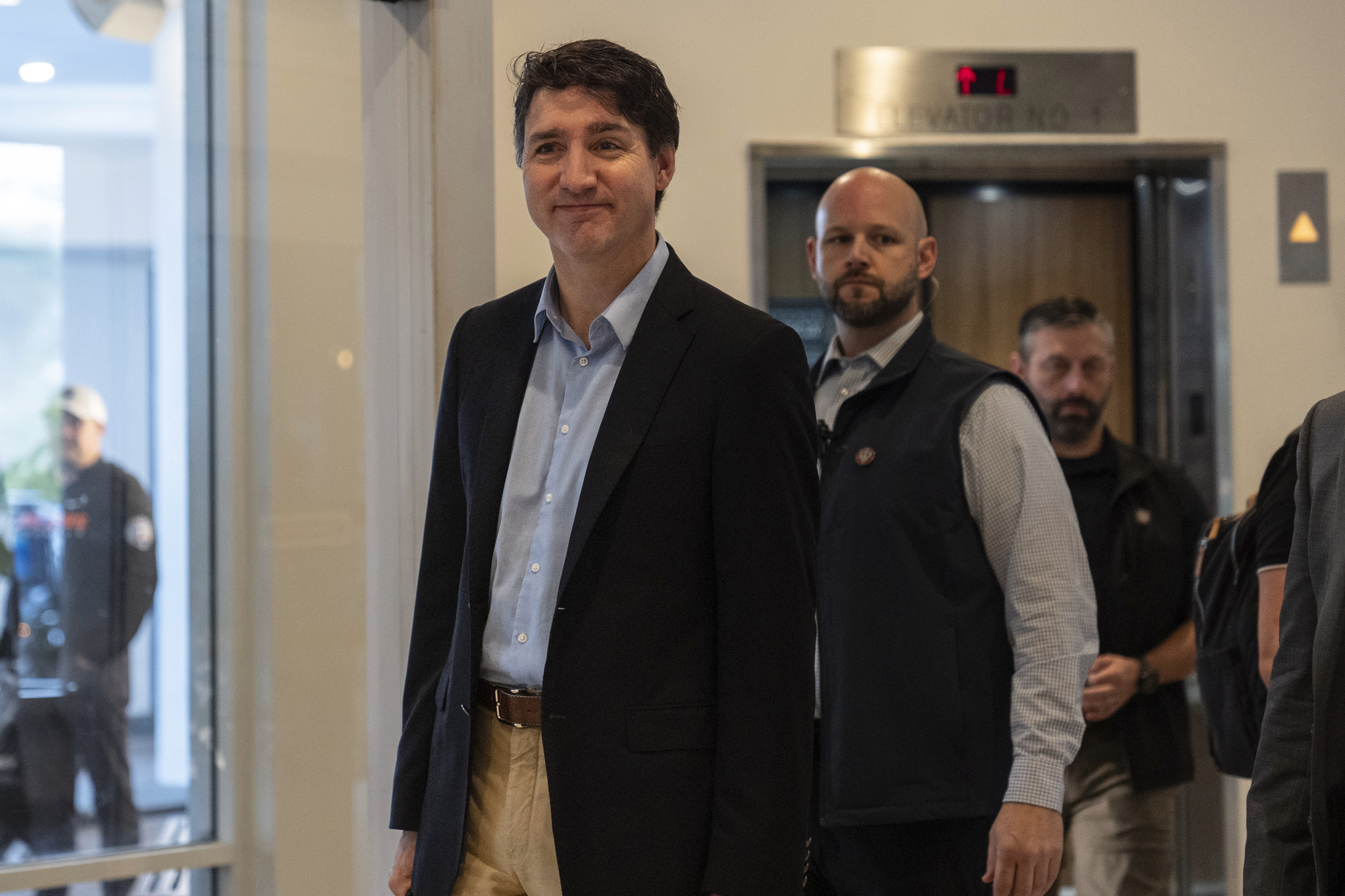 Canada Prime Minister Justin Trudeau walks through the lobby of the Delta Hotel by Marriott, Saturday, Nov. 30, 2024, in West Palm Beach, Fla. (AP Photo/Carolyn Kaster)