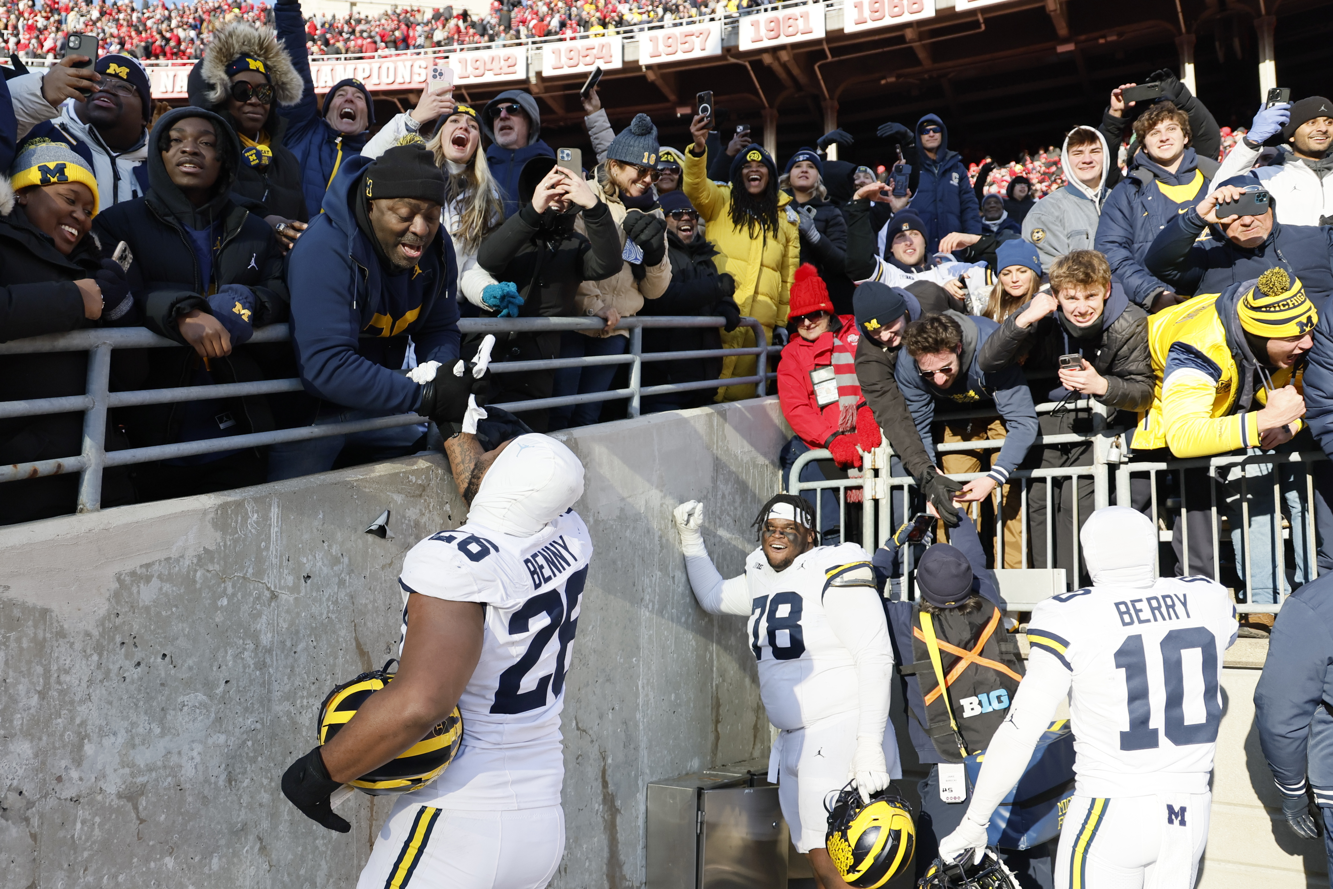 Michigan players celebrate their win over Ohio State in an NCAA college football game Saturday, Nov. 30, 2024, in Columbus, Ohio. (AP Photo/Jay LaPrete)