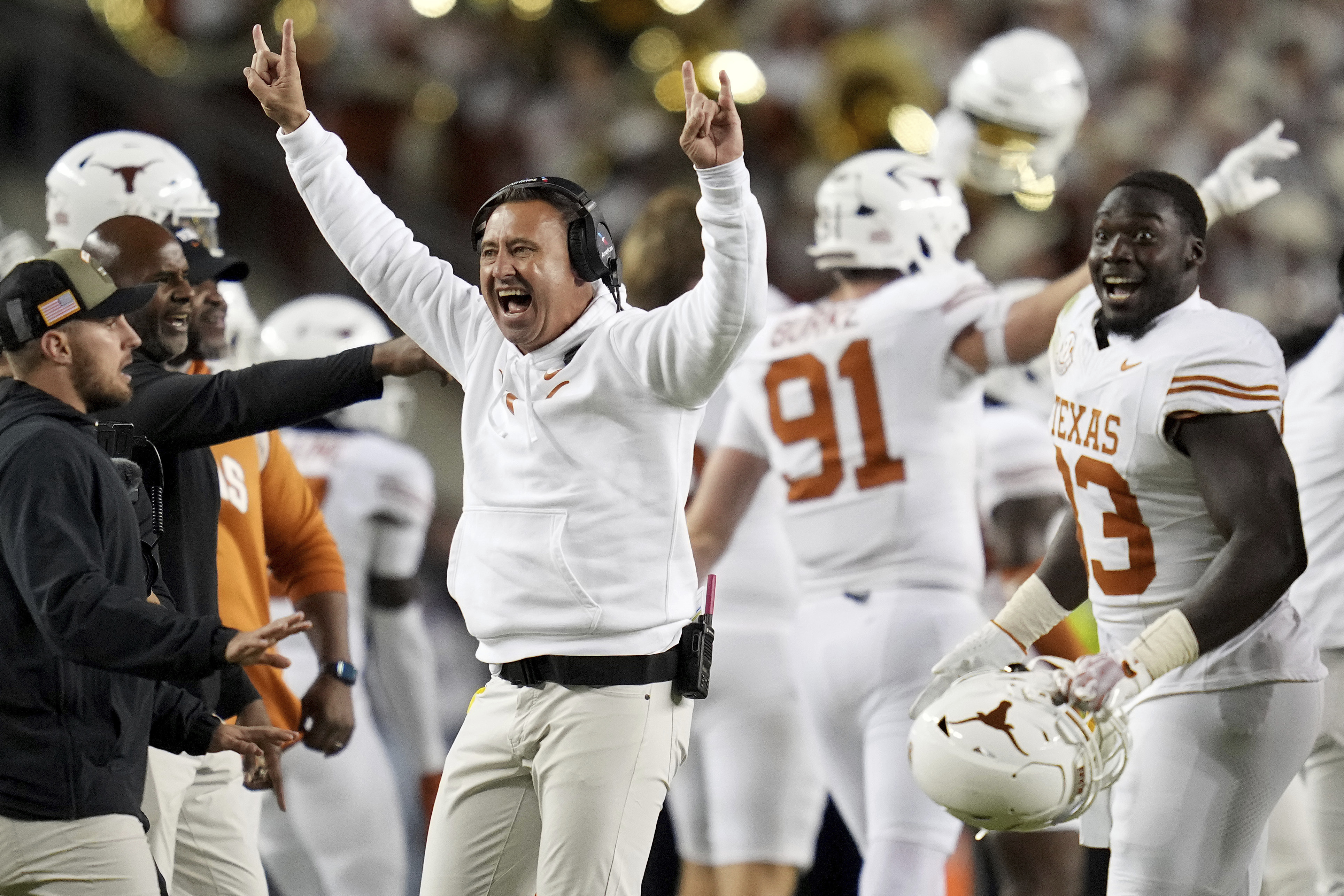 Texas head coach Steve Sarkisian, center left, reacts as his team recovers a fumble late in the fourth quarter of an NCAA college football game against Texas A&M, Saturday, Nov. 30, 2024, in College Station, Texas. (AP Photo/Sam Craft)