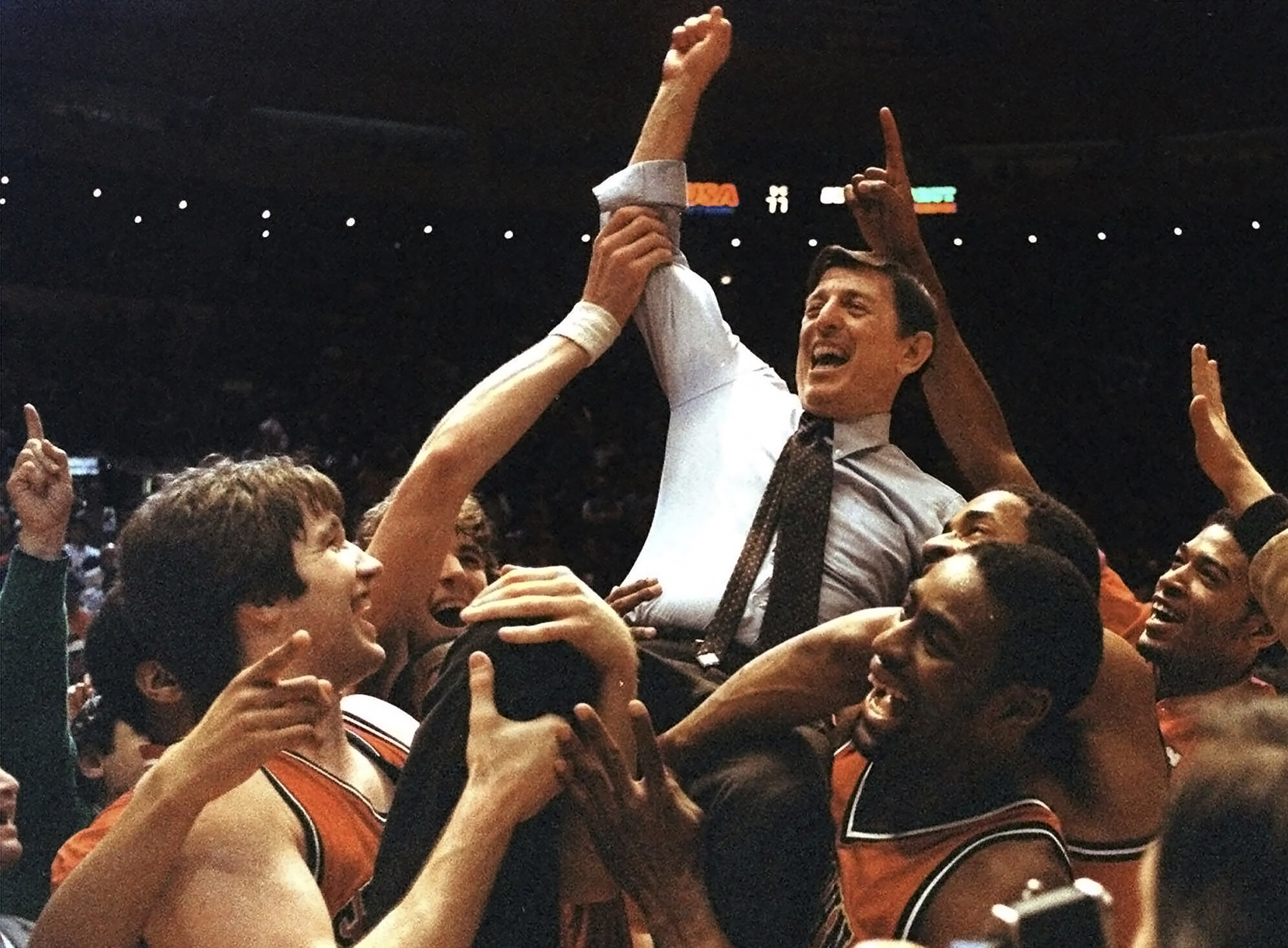 FILE - St. John's coach Lou Carnesecca is carried by his team after the Redman beat Boston College in the Big East Championship at New York's Madison Square Garden, on March 12, 1983. (AP Photo/G. Paul Burnett, File)