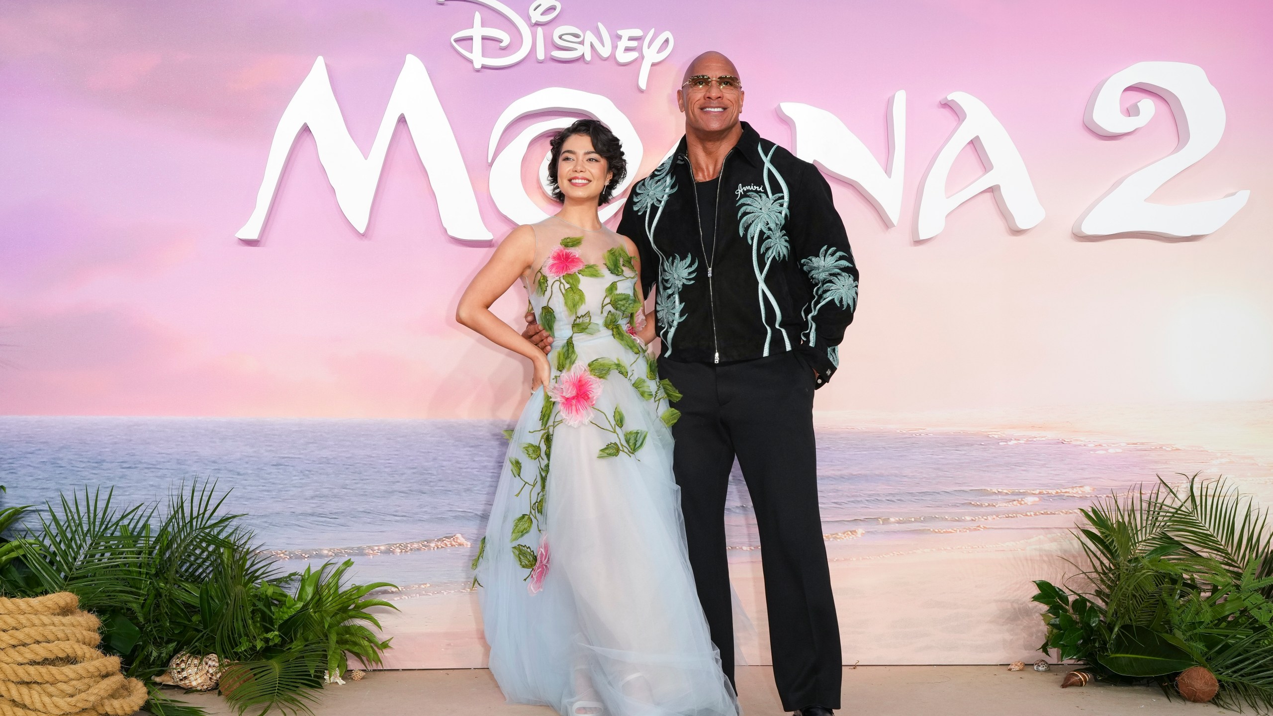 Auli'i Cravalho, left and Dwayne Johnson pose for photographers upon arrival at the UK premiere of Moana 2 on Sunday, Nov. 24, 2024, at a central London cinema. (Photo by Scott A Garfitt/Invision/AP)