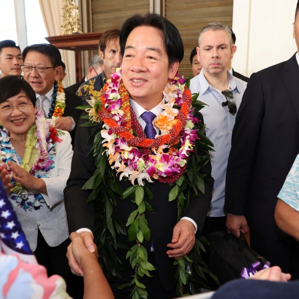 Taiwan President Lai Ching-te, center, greets people at the Kahala Hotel and Resort Saturday, Nov. 30, 2024 in Honolulu. (AP Photo/Marco Garcia)