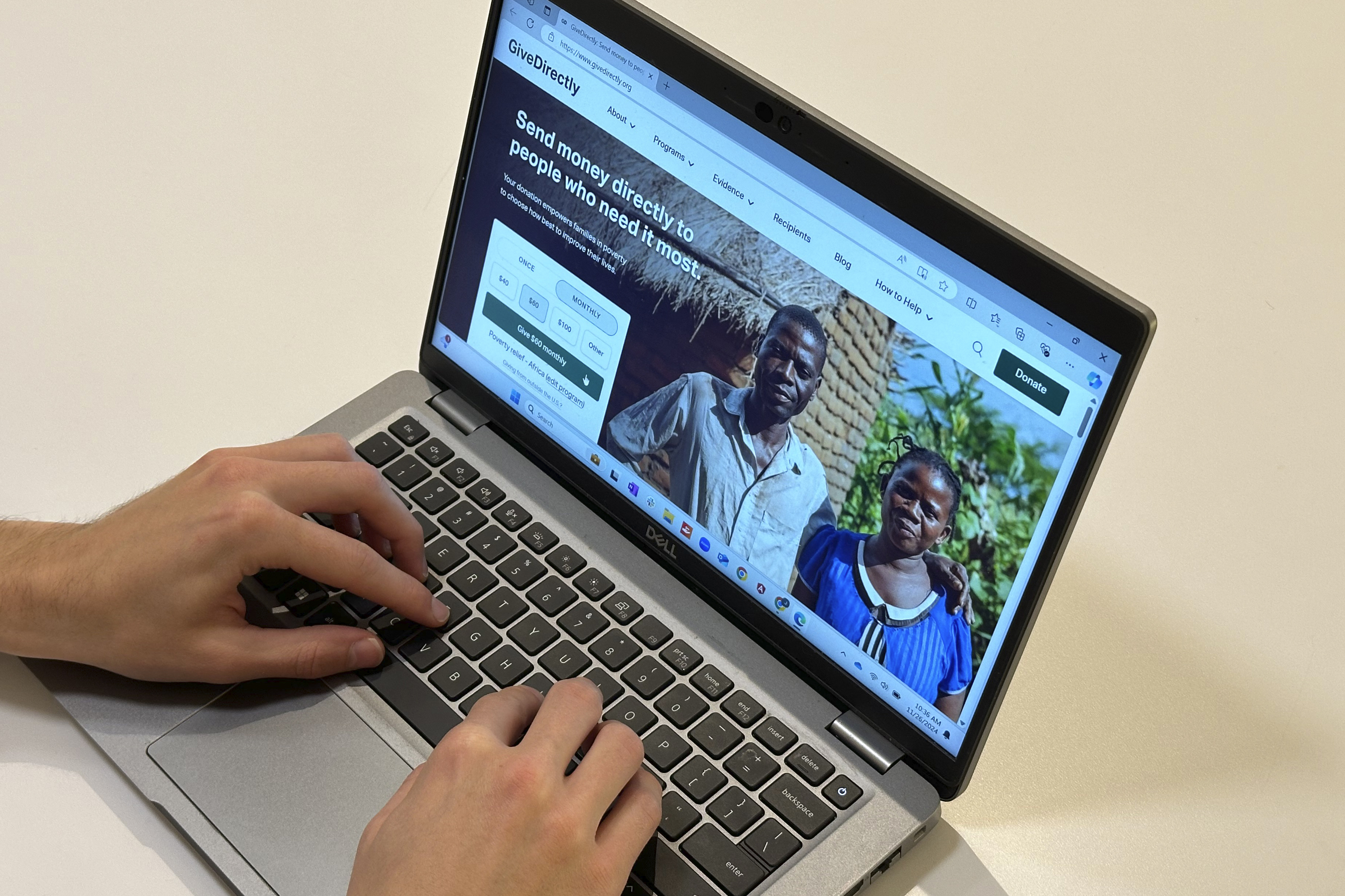 The website for the nonprofit GiveDirectly is displayed on a laptop on Nov. 26, 2024 in New York. (AP Photo/Peter Morgan)