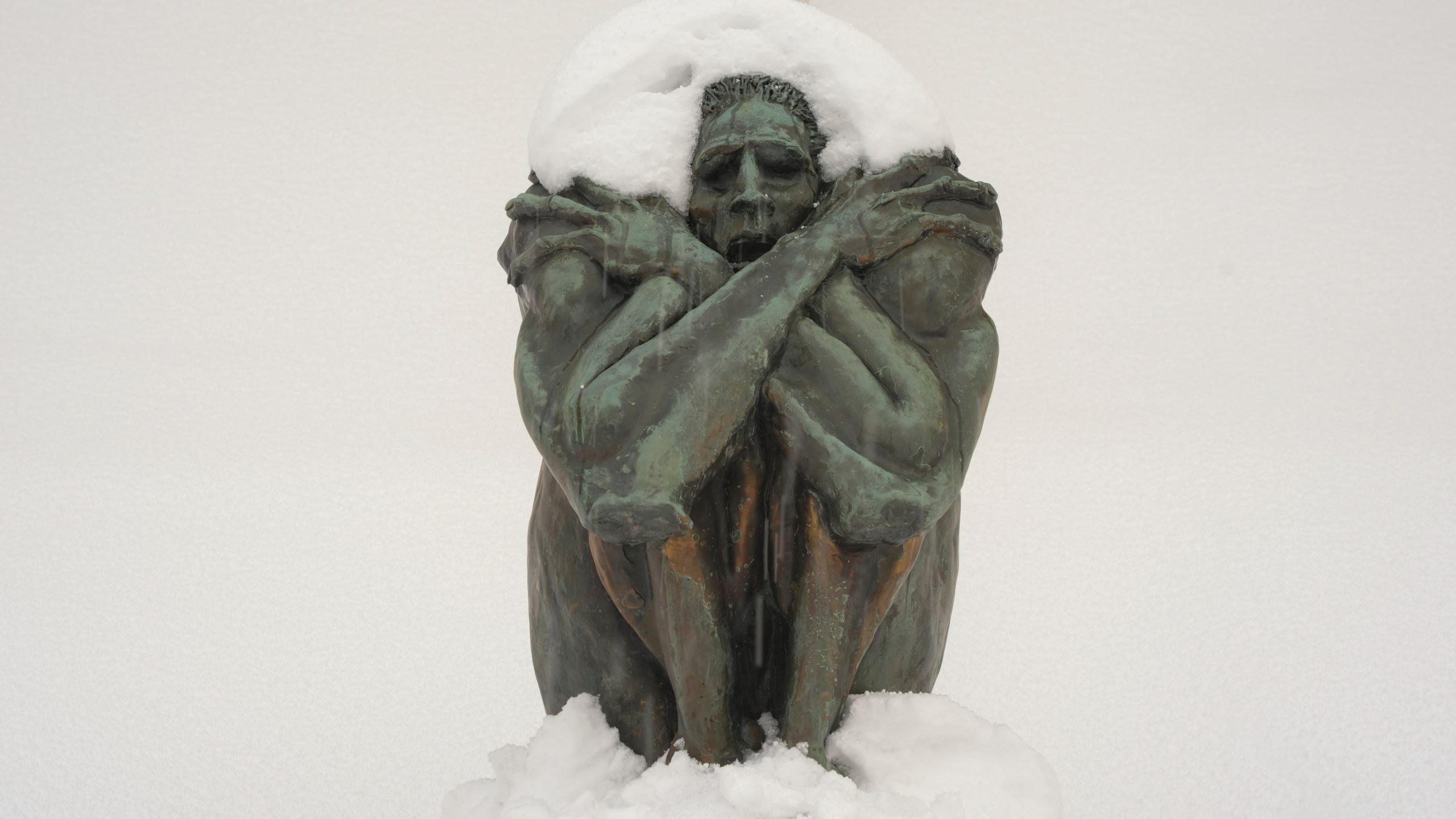 A sculpture is covered in snow on the steps of Erie Art Museum Tuesday, Nov. 5, 2024 in Erie, Pa. (AP Photo/Gene J. Puskar)