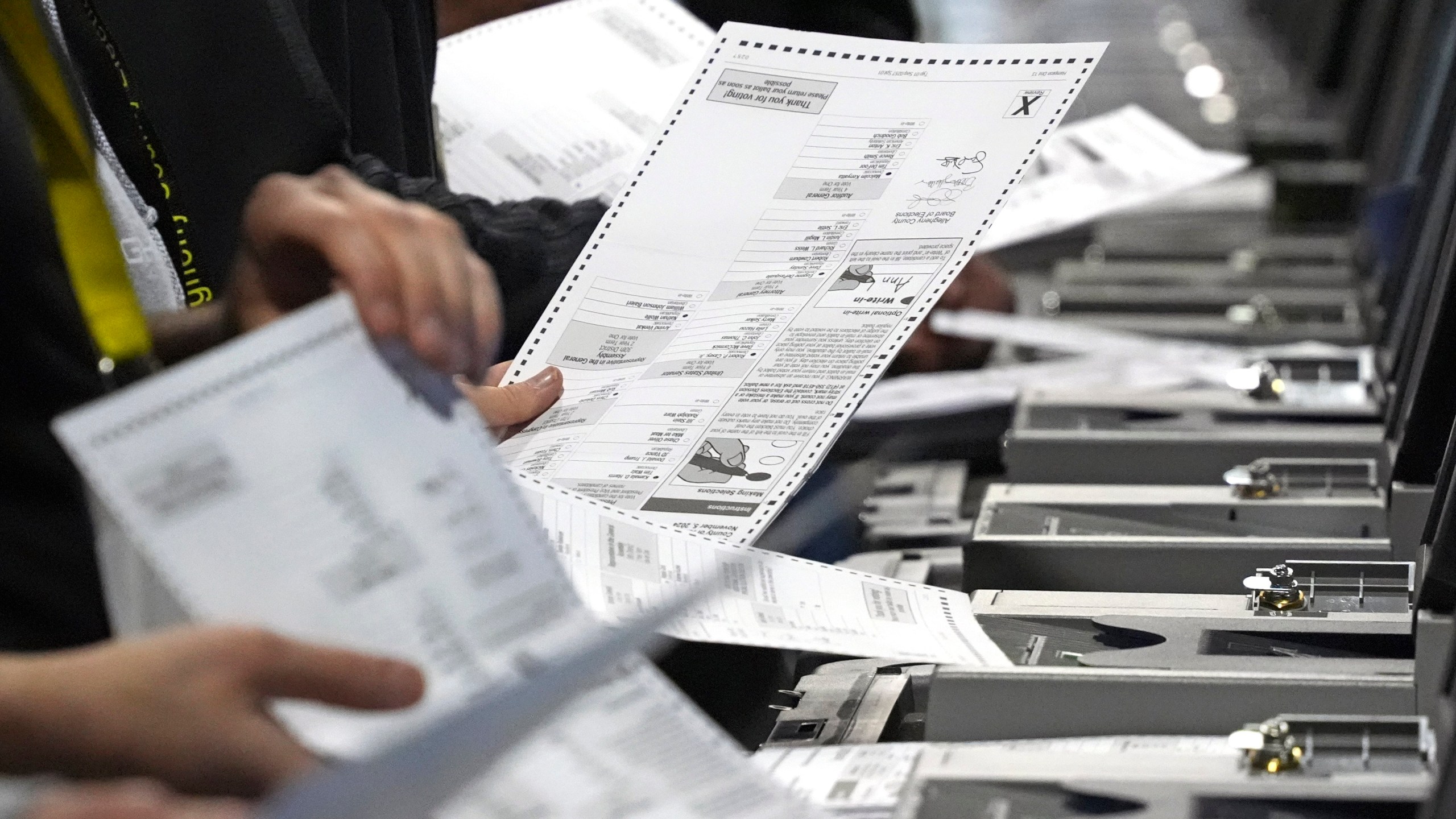 FILE - Election workers recount ballots from the recent Pennsylvania Senate race at the Allegheny County Election Division warehouse on the Northside of Pittsburgh, Wednesday, Nov. 20, 2024. (AP Photo/Gene J. Puskar, File)