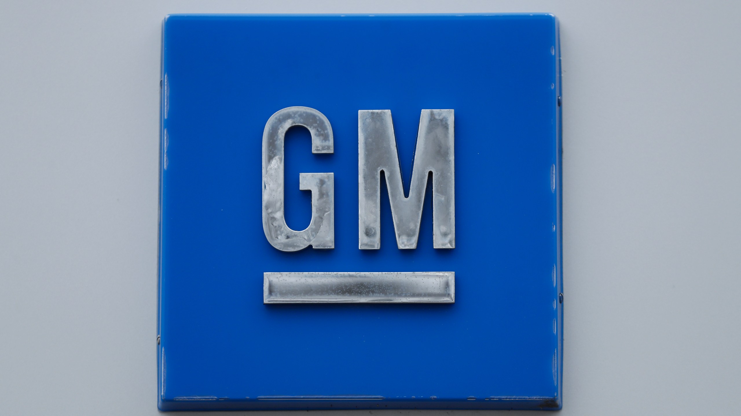 FILE - A GM logo is shown at the General Motors Detroit-Hamtramck Assembly plant in Hamtramck, Mich., Jan. 27, 2020. (AP Photo/Paul Sancya, File)