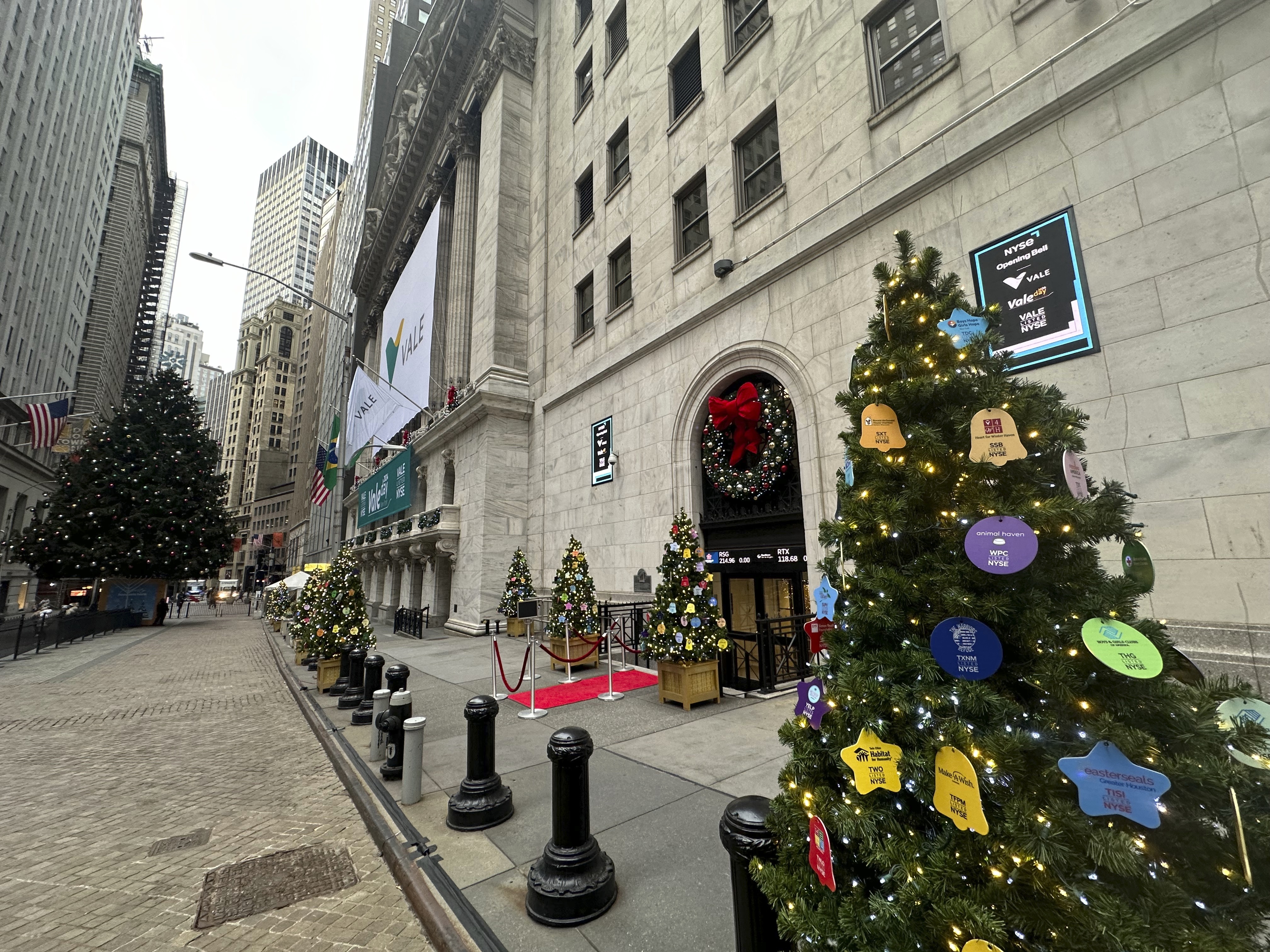 Holiday decorations are shown in front of the New York Stock Exchange in New York's Financial District on Tuesday, Dec. 3, 2024. (AP Photo/Peter Morgan)