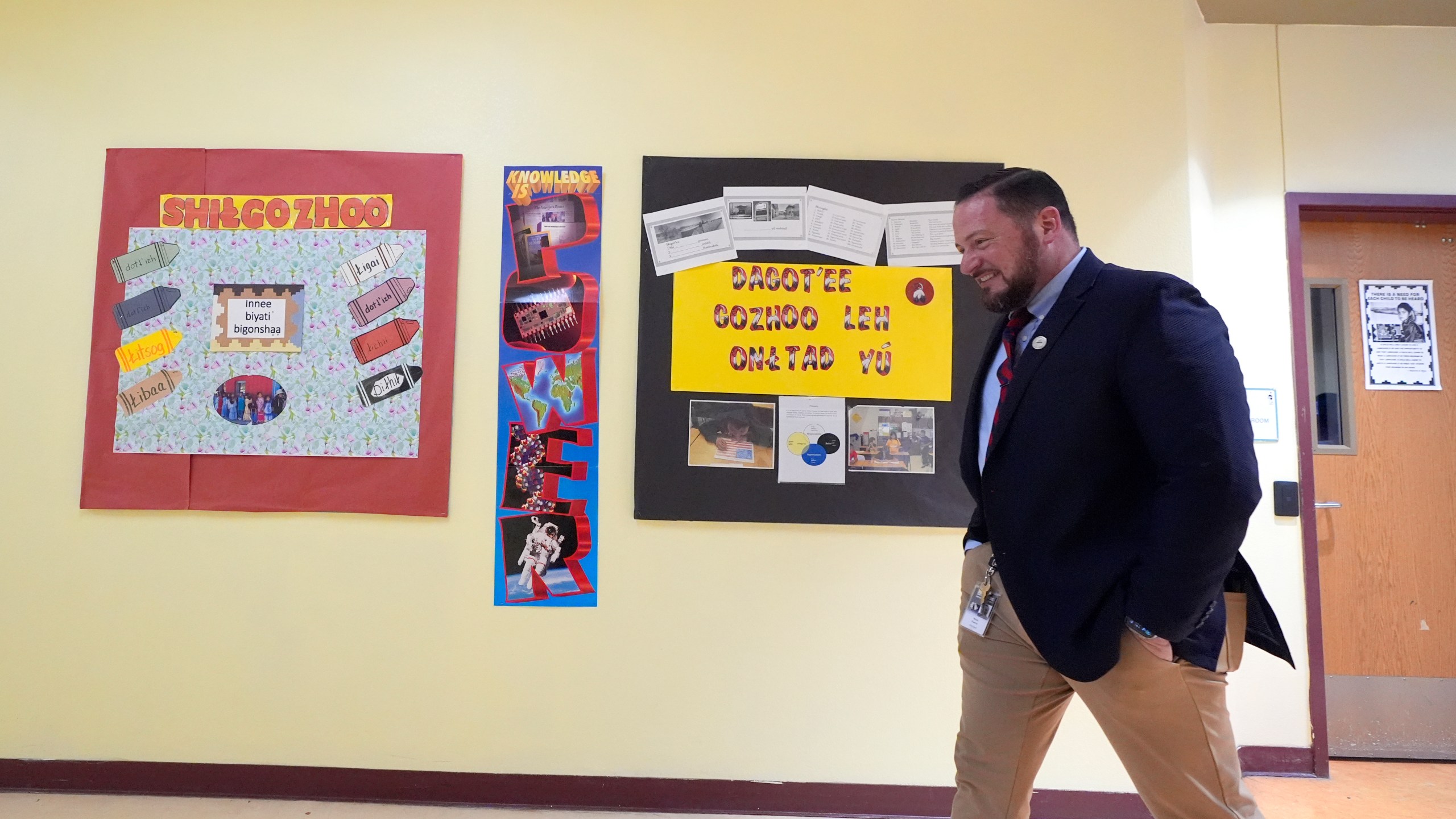 Rice Intermediate School Principal Nicholas Ferro walks to a classroom at Rice Intermediate School Tuesday, Aug. 27, 2024, in San Carlos, Ariz. (AP Photo/Ross D. Franklin)