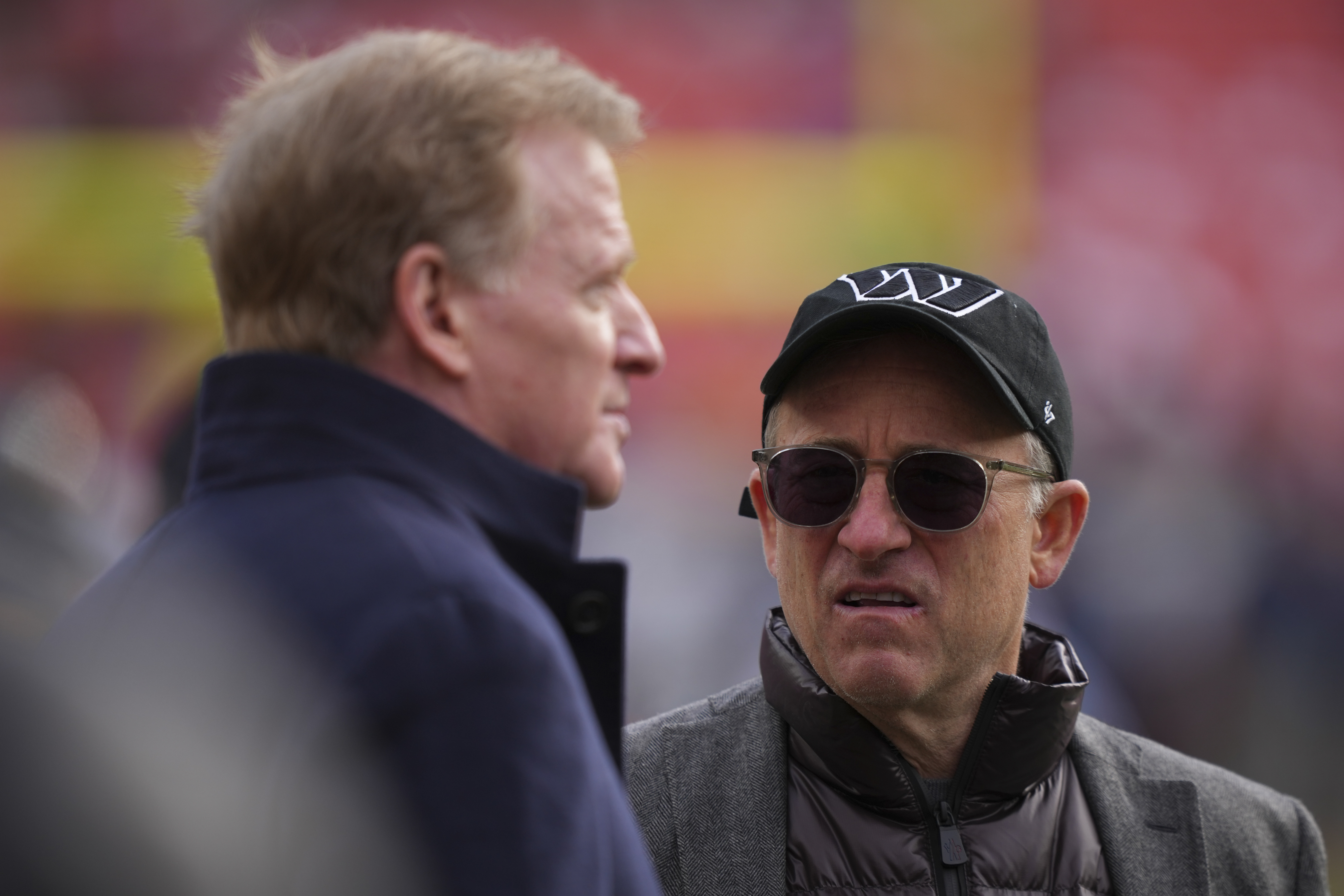 FILE - Washington Commanders managing partner Josh Harris, right, speaks with league commissioner Roger Goodell before an NFL football game against the Tennessee Titans, Sunday, Dec. 1, 2024, in Landover, Md. (AP Photo/Matt Slocum, File)