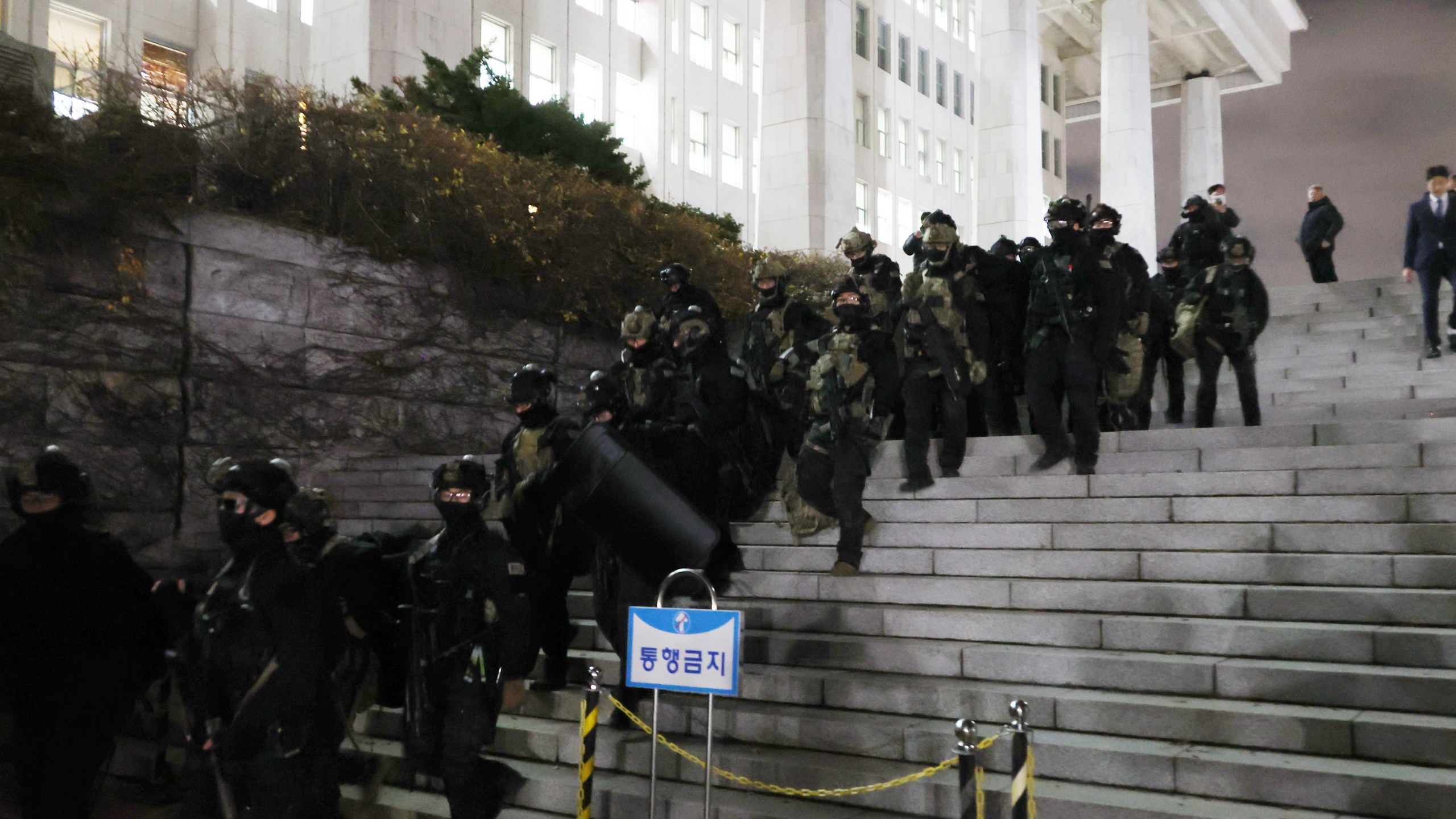 South Korean martial law soldiers leave the National Assembly in Seoul, South Korea, Wednesday, Dec. 4, 2024. (Kim Ju-sung/Yonhap via AP)