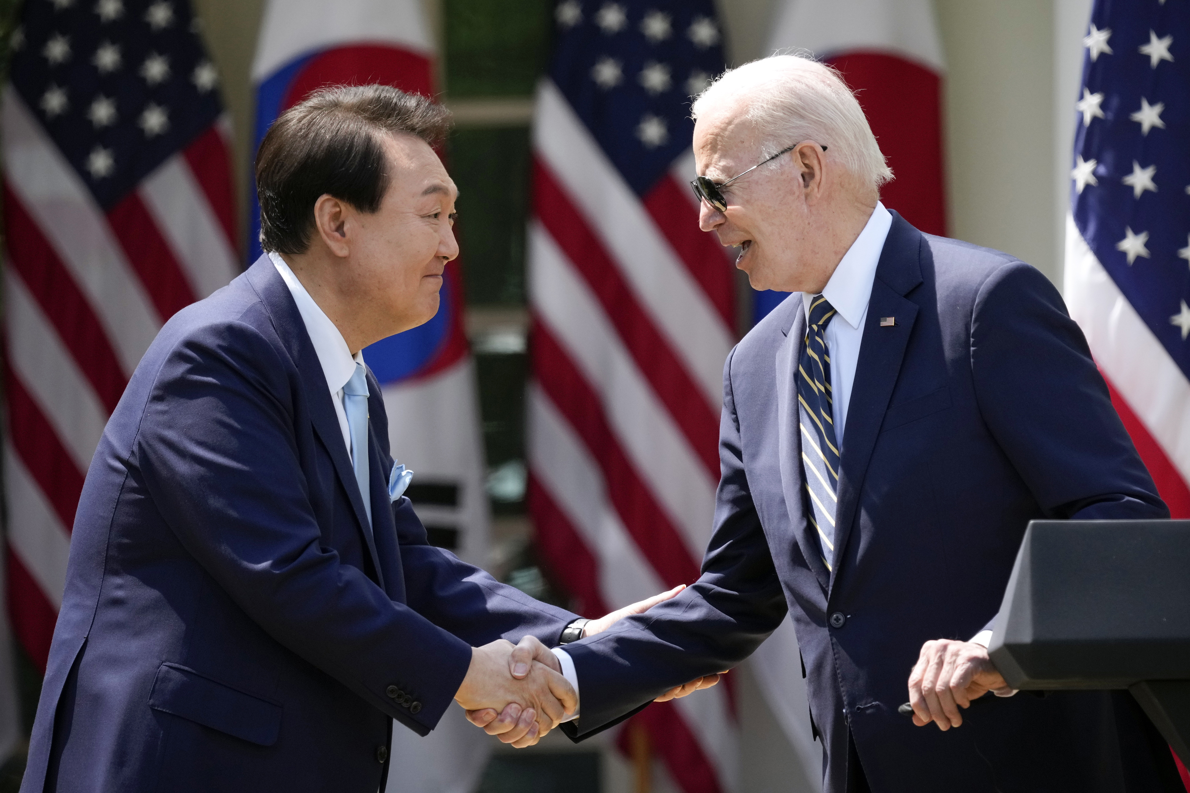 FILE - President Joe Biden, right, and South Korea's President Yoon Suk Yeol shake hands during a news conference in the Rose Garden of the White House, April 26, 2023, in Washington. (AP Photo/Andrew Harnik, File)