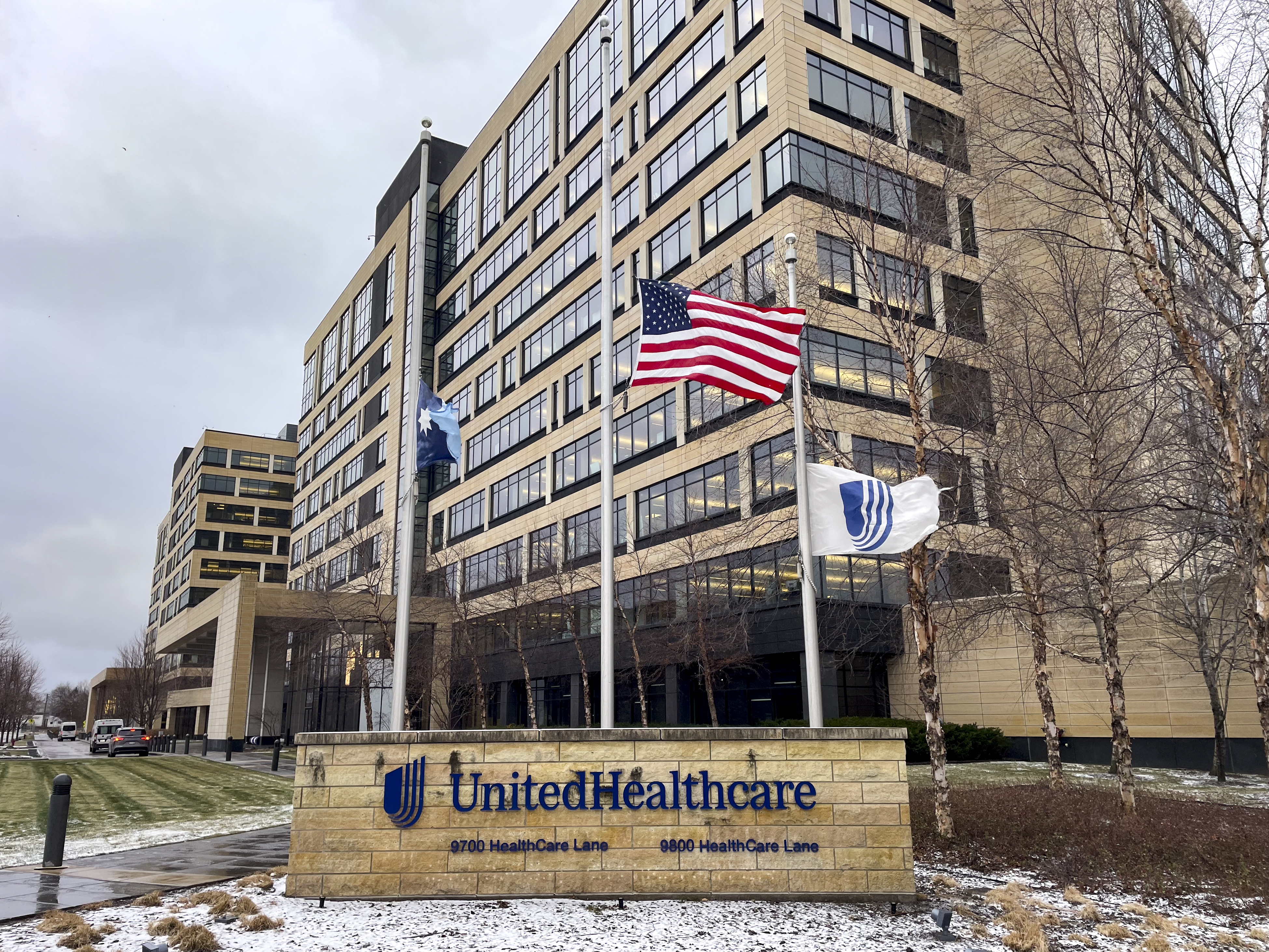 The UnitedHealthcare headquarters in Minnetonka, Minn., lowered its flags to half-staff on Wednesday, Dec. 4, 2024, in honor of CEO Brian Thompson, who was fatally shot outside a hotel in New York. (Kerem Yücel/Minnesota Public Radio via AP)