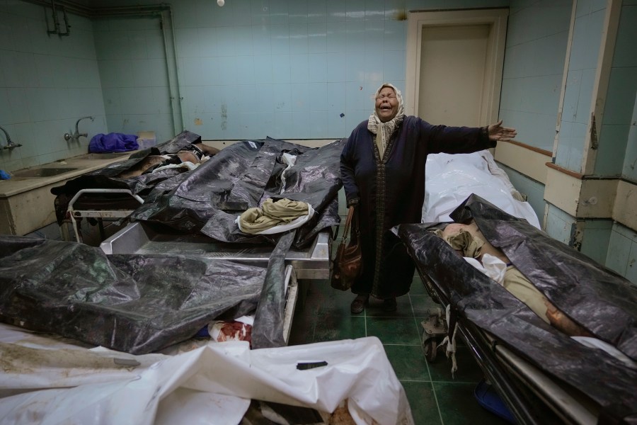 Hilala Meryeh, a 64-year-old Palestinian mother of four, weeps in the middle of the dingy identification room after finding her son's body at the Al-Mojtahed Hospital morgue in Damascus, Syria, on Wednesday, Dec. 11, 2024. Many are flocking to morgues, hoping to identify loved ones who were either killed or imprisoned under President Bashar Assad's government, which collapsed over the weekend. (AP Photo/Hussein Malla)