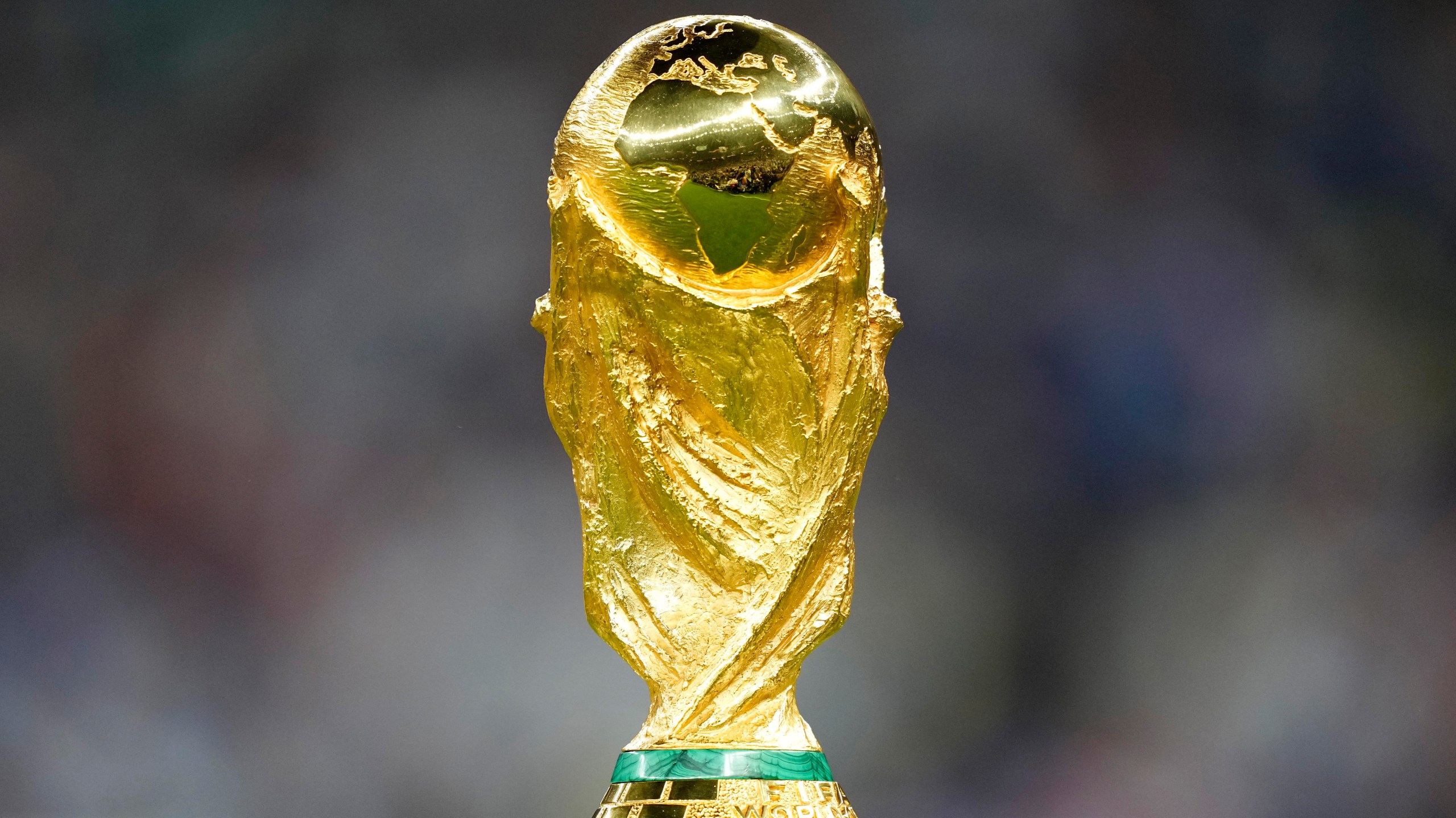 FILE - The trophy is displayed on the pitch ahead of the World Cup final soccer match between Argentina and France at the Lusail Stadium in Lusail, Qatar, Sunday, Dec. 18, 2022. (AP Photo/Martin Meissner, File)