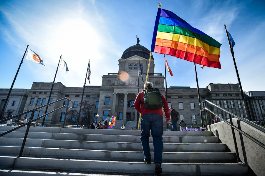 FILE - Demonstrators gather on the steps of the Montana state Capitol protesting anti-LGBTQ+ legislation in Helena, Mont., March 15, 2021. (Thom Bridge/Independent Record via AP, File)