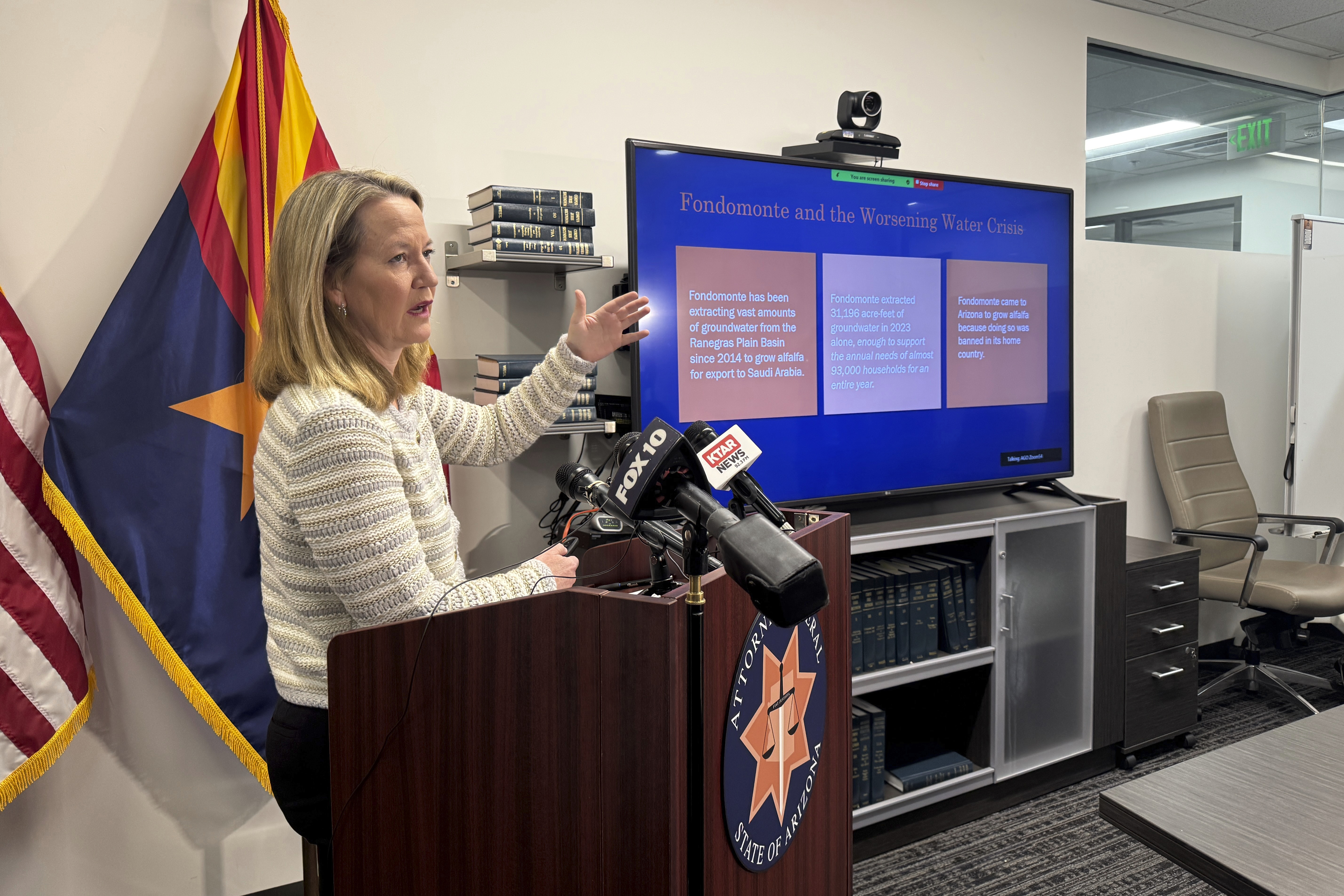 Arizona Attorney General Kris Mayes announces she's suing a Saudi Arabian company for allegedly pumping groundwater that harms local communities in a rural western county, Wednesday, Dec. 11, 2024, in Phoenix. (AP Photo/Gabriel Sandoval)