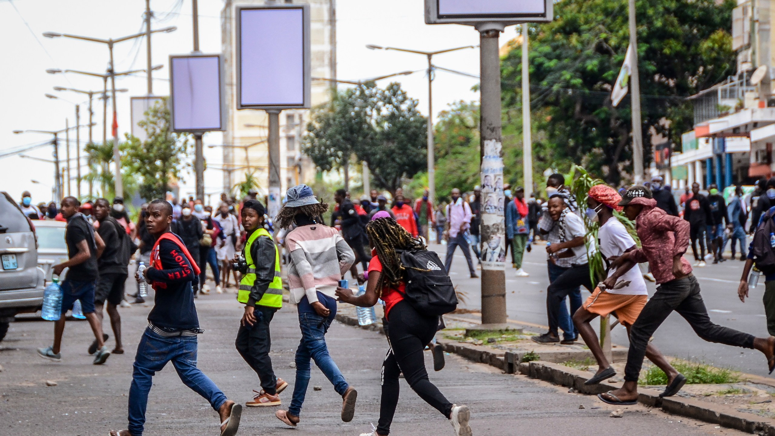 FILE - Protesters disperse as police deploy in Maputo, Mozambique, Thursday, Nov. 7, 2024. Protesters dispute the outcome of the Oct. 9 elections, which saw the ruling Frelimo party extend its 49-year rule. (AP Photo/Carlos Uqueio, File)