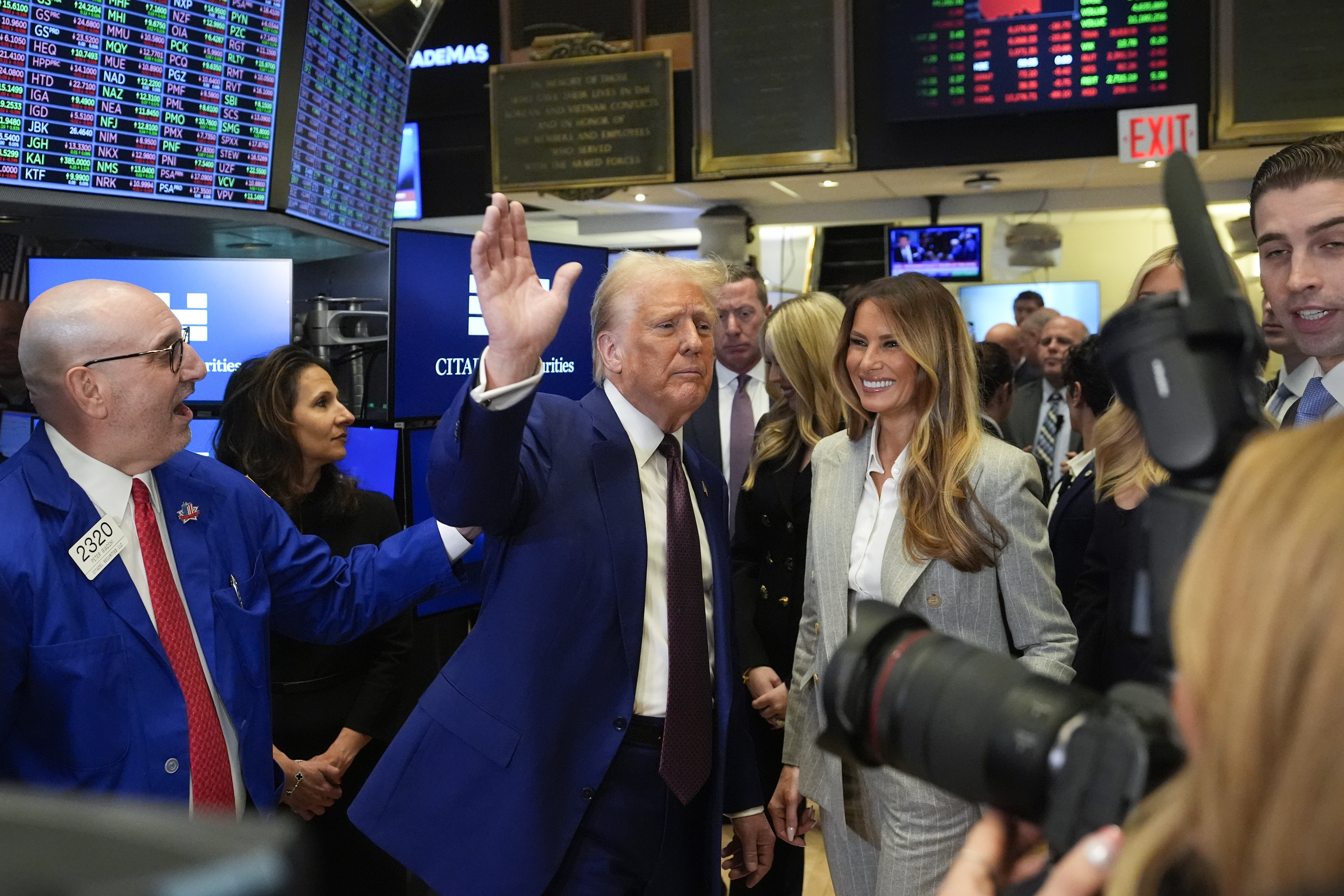 President-elect Donald Trump, with Lynn Martin, President NYSE, center, Melania Trump, right and trader Peter Giacchi, left, walks the floor of the New York Stock Exchange, Thursday, Dec. 12, 2024, in New York. (AP Photo/Alex Brandon)