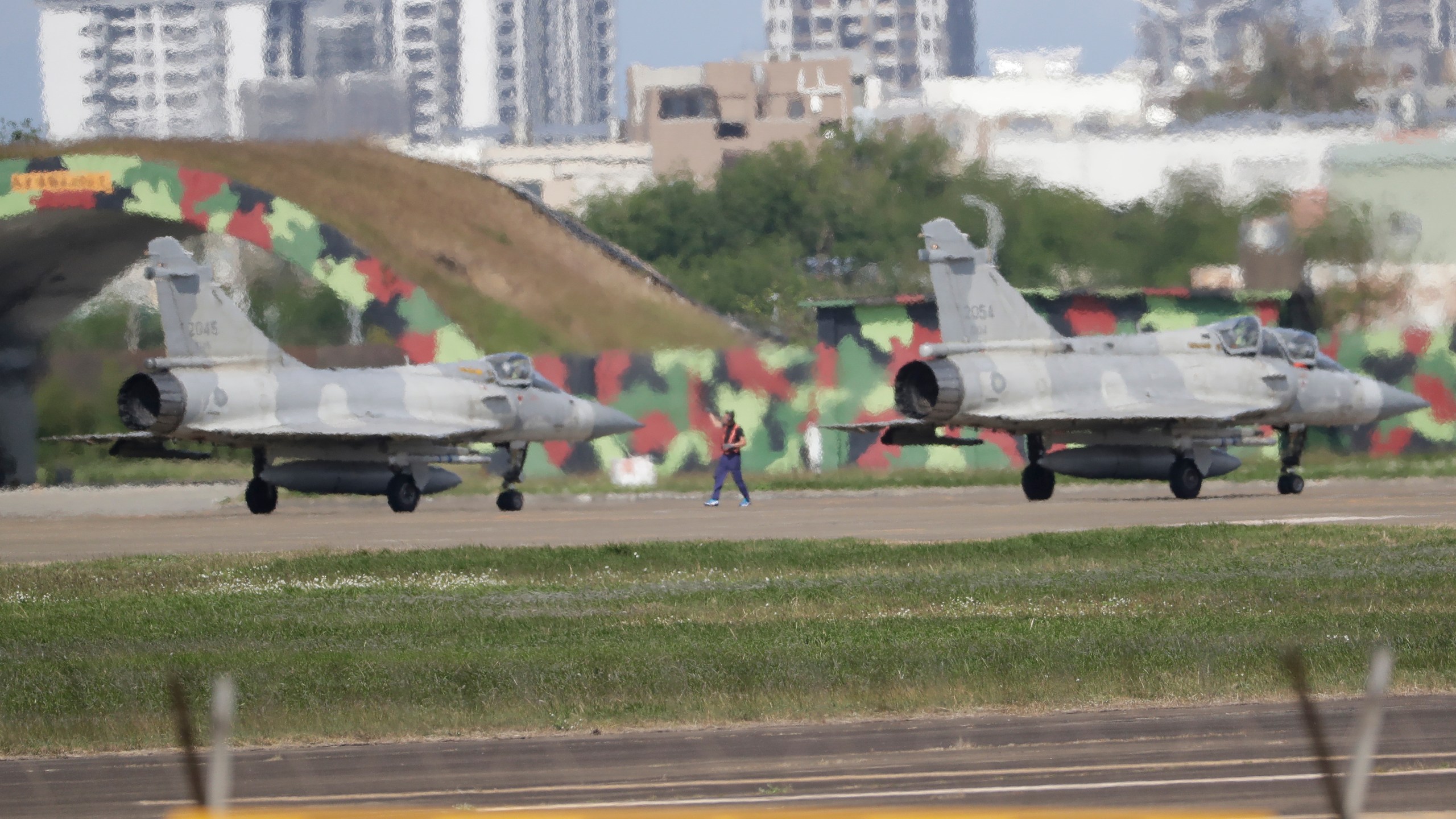 Taiwan's fighter jets prepare to take off at an airbase in Hsinchu, northern Taiwan, Wednesday, Dec. 11, 2024, as Taiwan's Defense Ministry said it detected Chinese naval ships and military planes engaged in training. (AP Photo/Chiang Ying-ying)