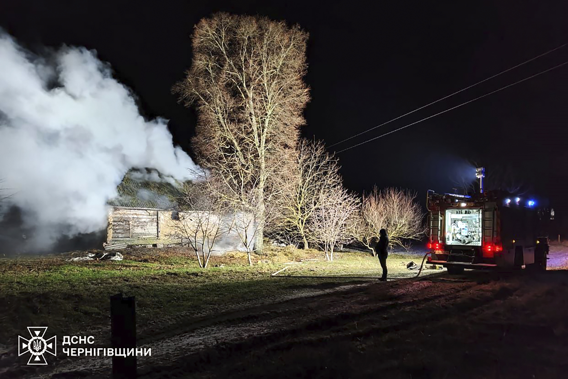 In this photo provided by the Ukrainian Emergency Service, firefighters work on the site of a damaged building after a Russian drone attack in Chernihiv region, Ukraine, early Friday, Dec. 13, 2024. (Ukrainian Emergency Service via AP Photo)