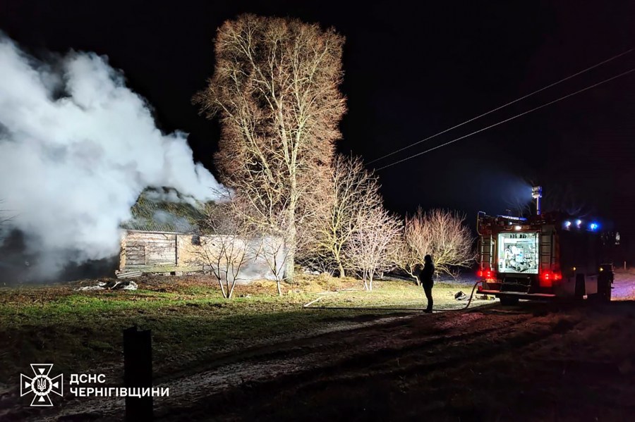 In this photo provided by the Ukrainian Emergency Service, firefighters work on the site of a damaged building after a Russian drone attack in Chernihiv region, Ukraine, early Friday, Dec. 13, 2024. (Ukrainian Emergency Service via AP Photo)