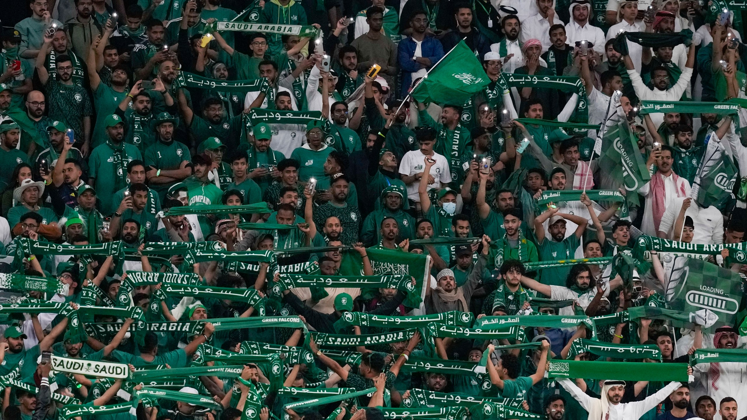 FILE - Saudi Arabia fans support their team during the Asian Cup Round of 16 soccer match between Saudi Arabia and South Korea, at the Education City Stadium in Al Rayyan, Qatar, Jan. 30, 2024. (AP Photo/Thanassis Stavrakis, File)